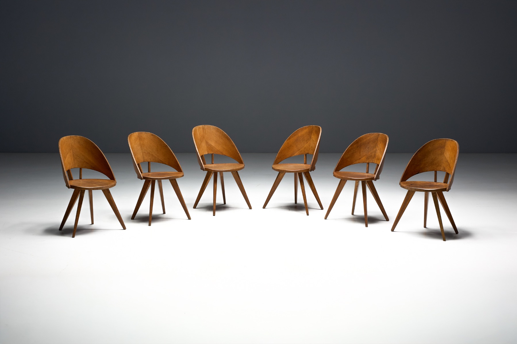 Modernist Italian plywood dining chairs dating to the 1940s