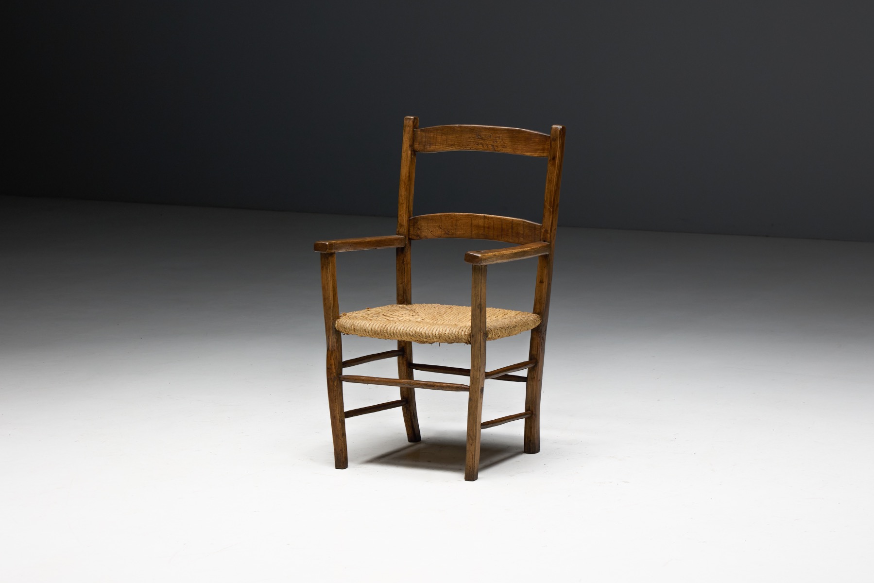 Aged wood vernacular rural armchair with authentic wear