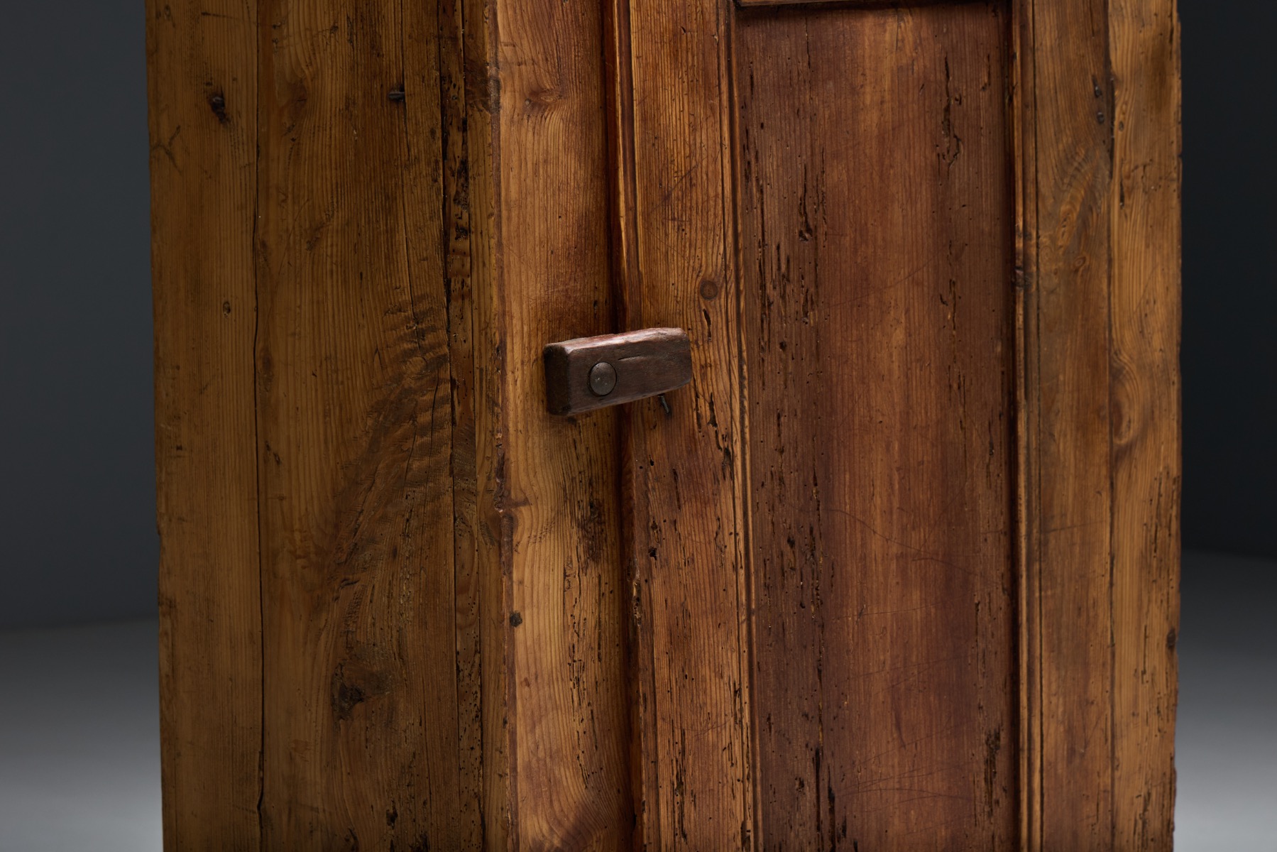 Historic Alpine wooden cupboard with timeworn surface