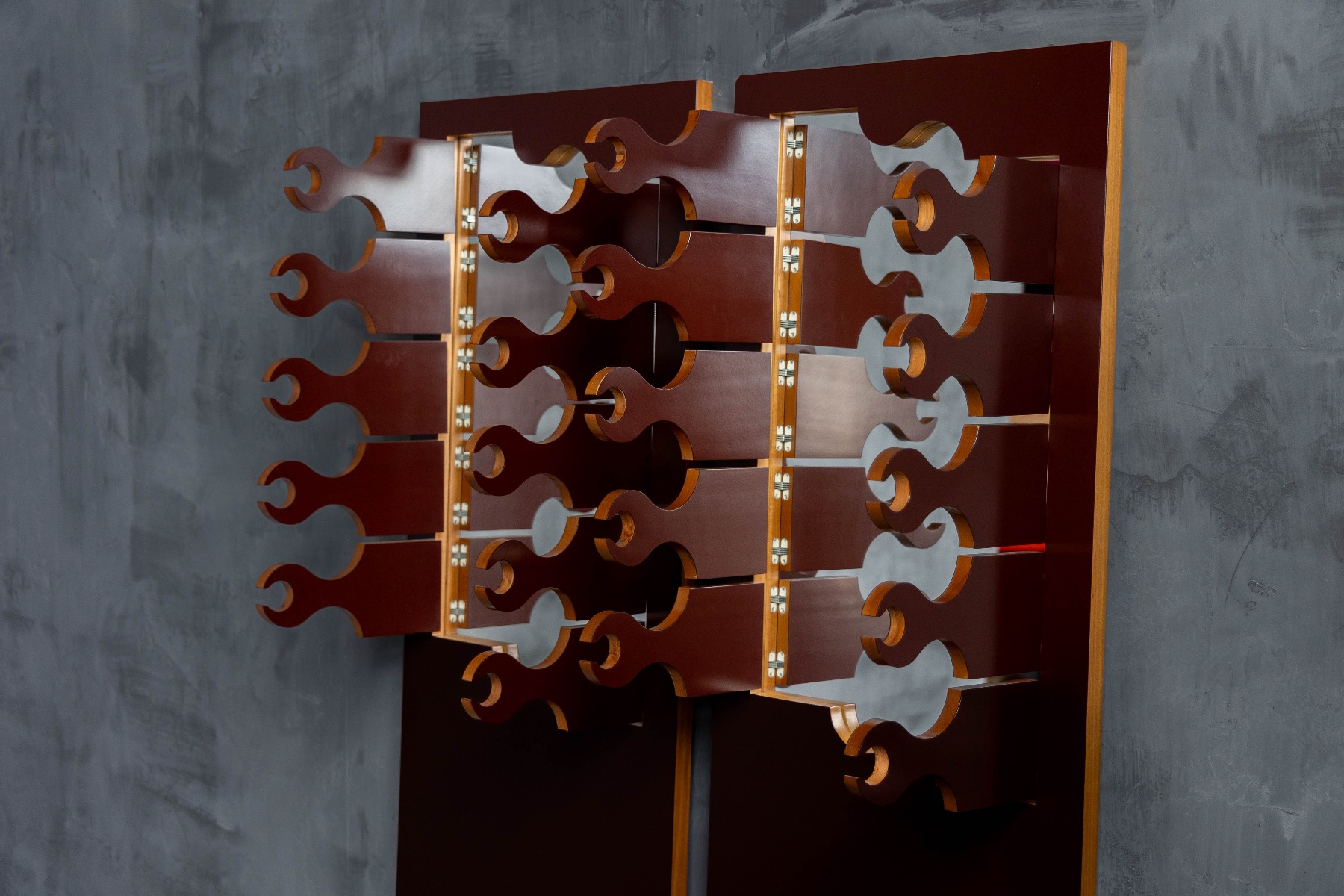 Sculptural metal coat rack with integrated mirror