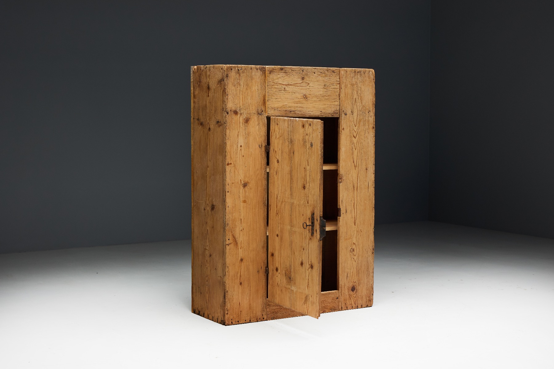 Brutalist wood cabinet with folk design
