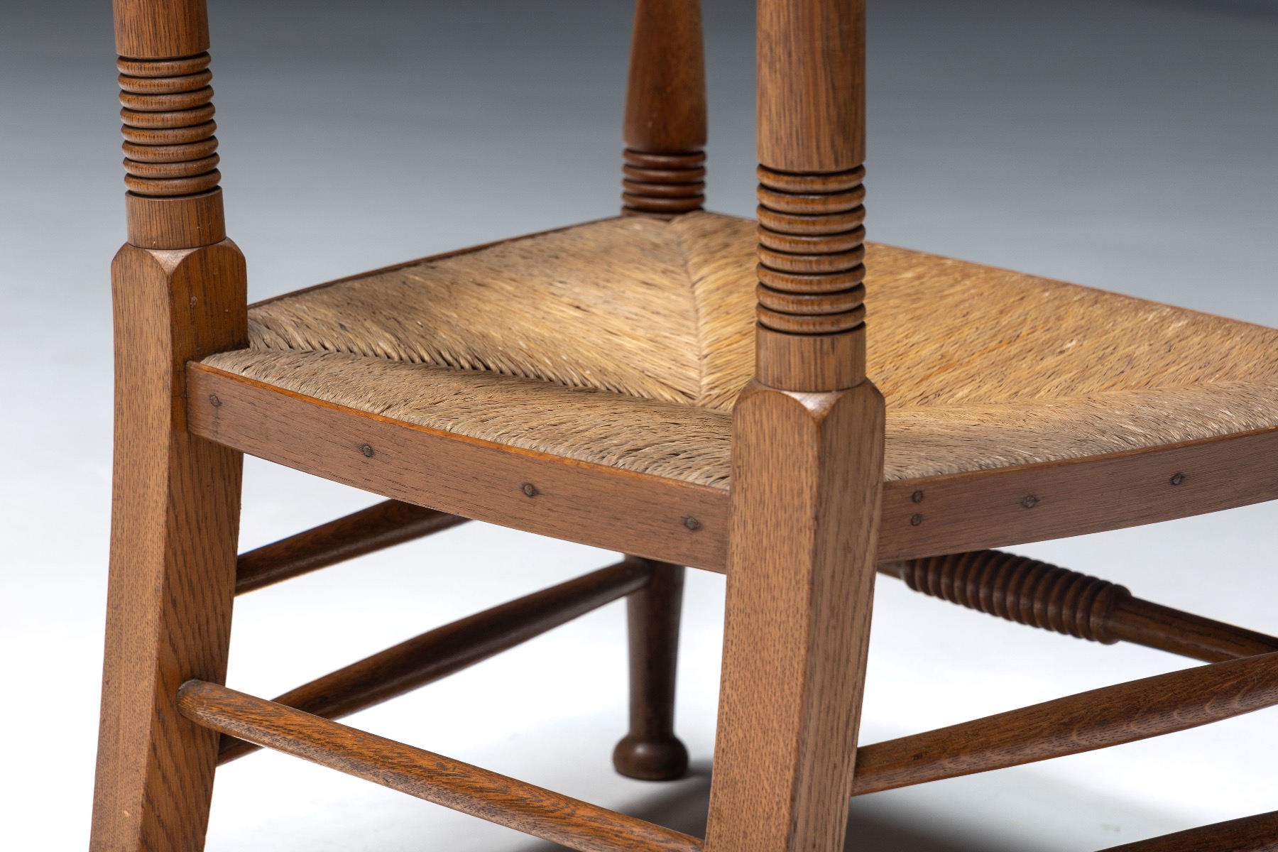 Country style oak armchair with straw seating