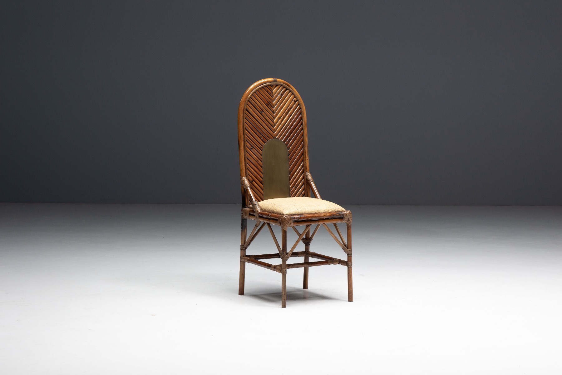Elegant high back chair with bamboo and brass materials