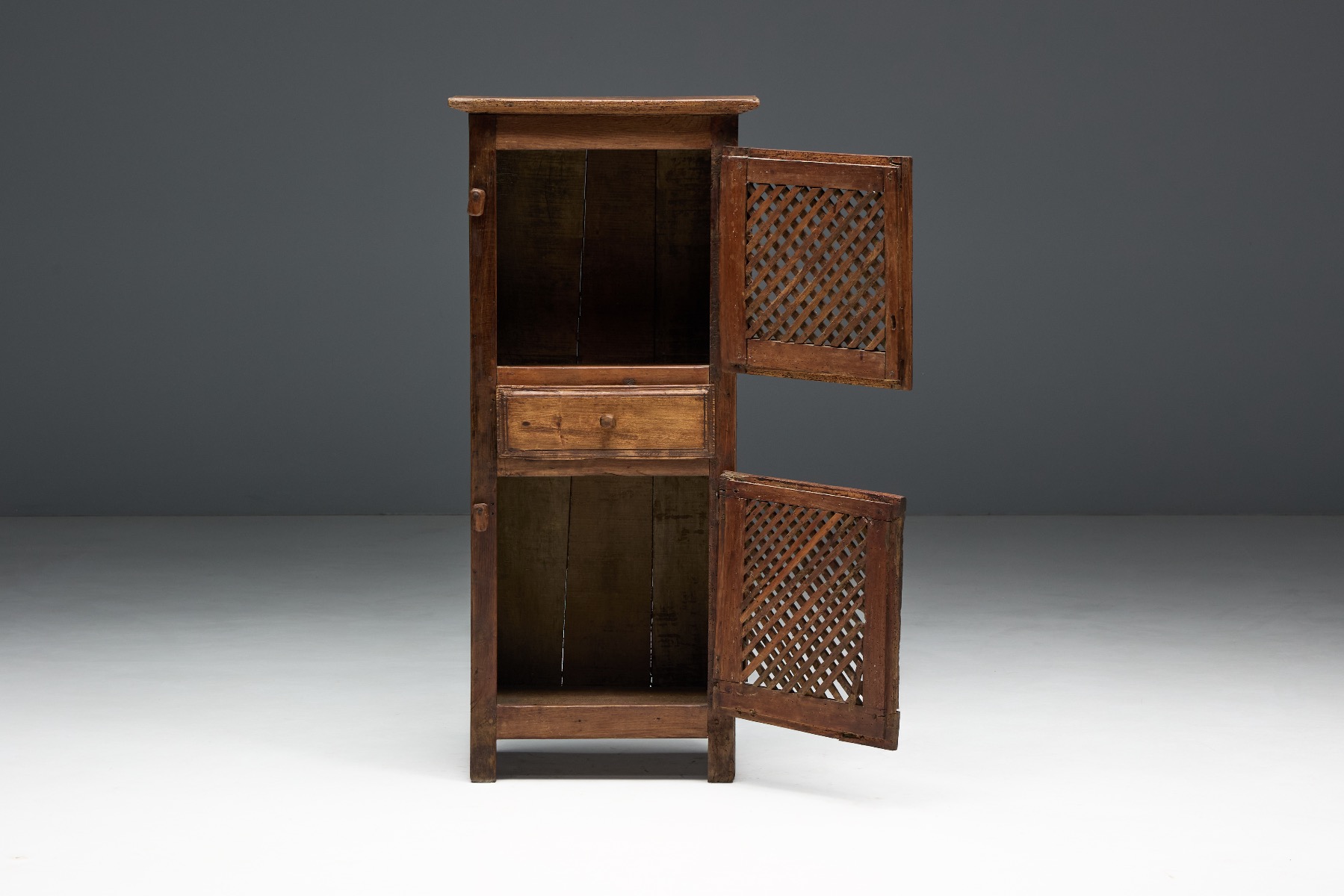 Farmhouse rustic folk art cabinet from the 19th century