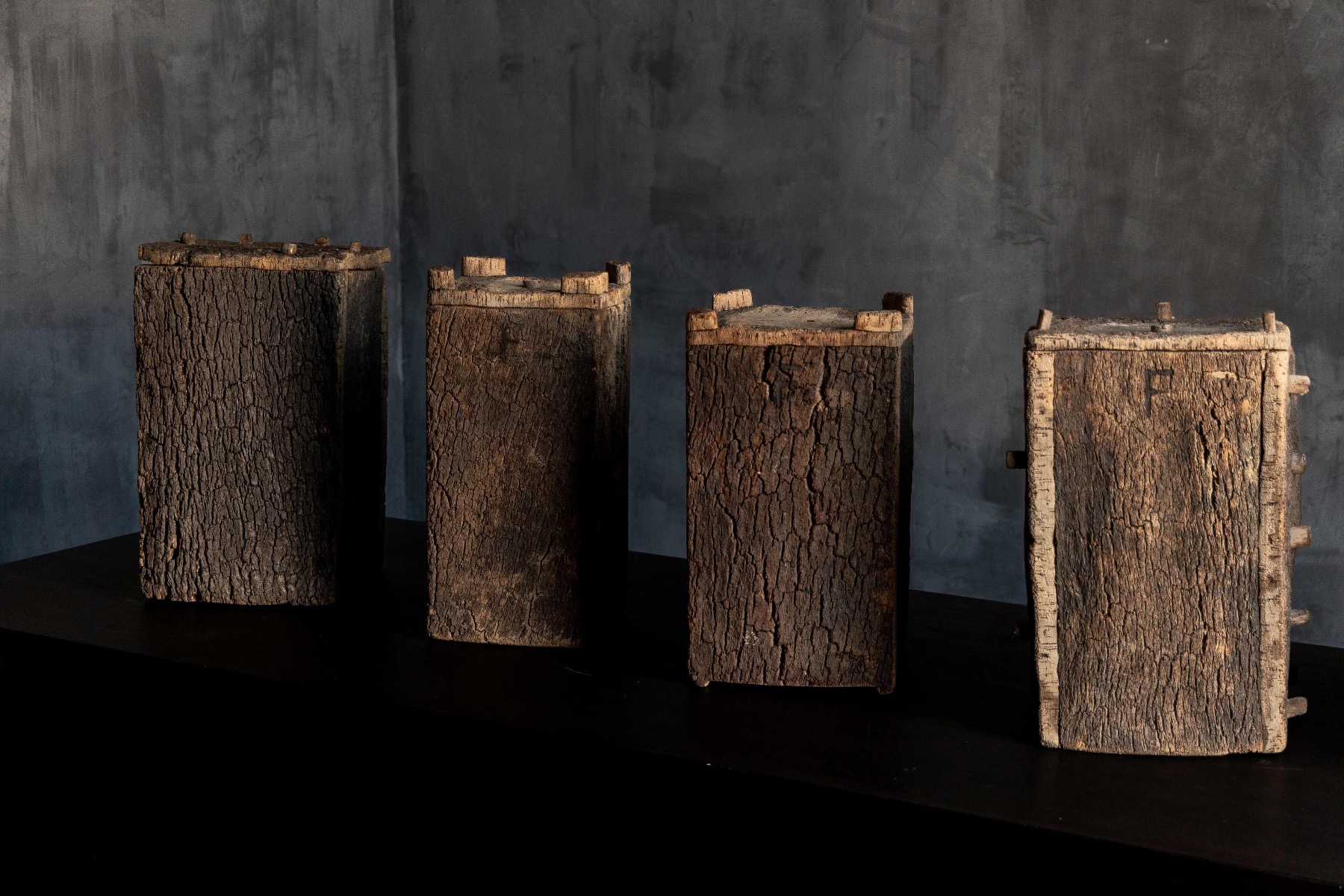 Expressive rural beehives with aged wood grain