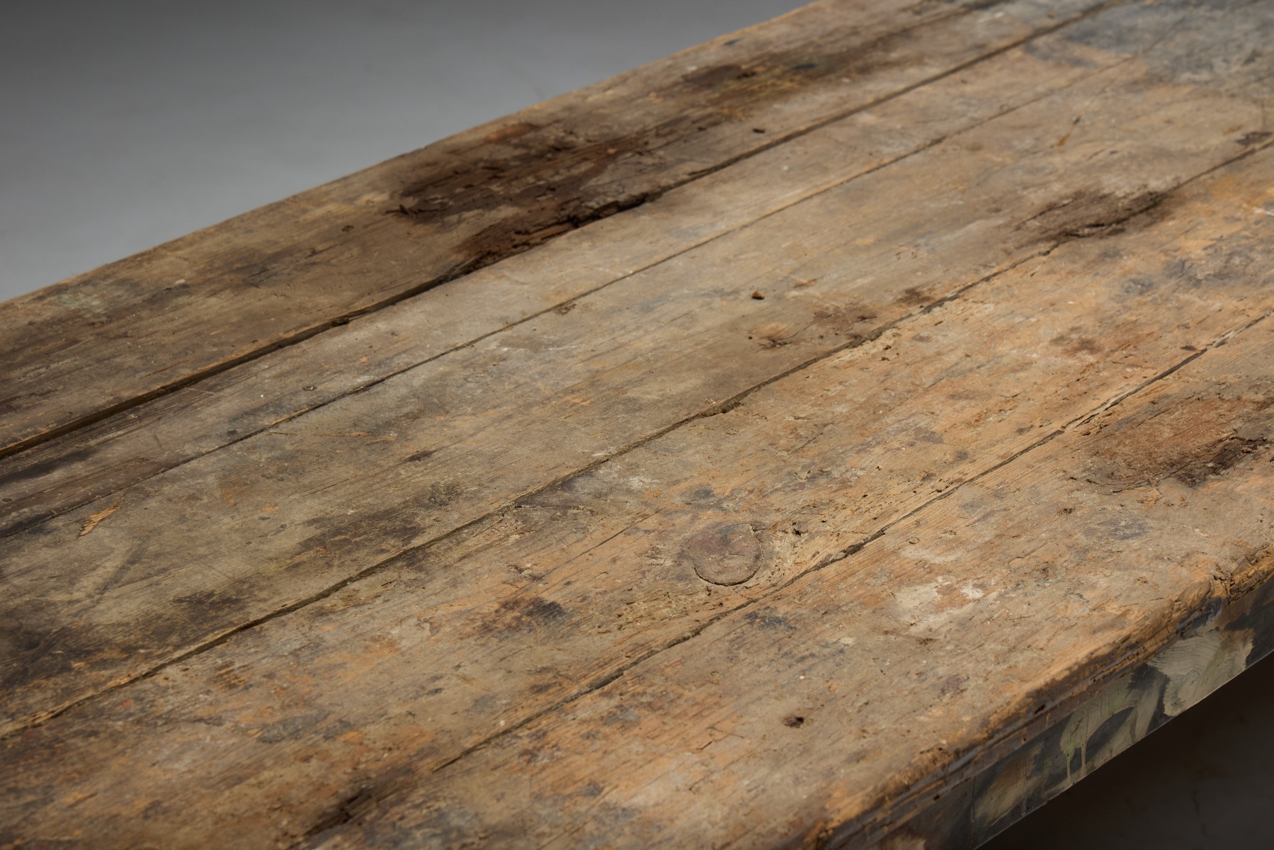 Primitive dining table showing honest use and patina