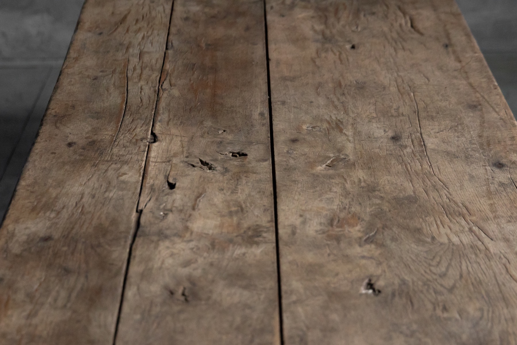 Handcrafted wooden farmhouse dining table with rustic character