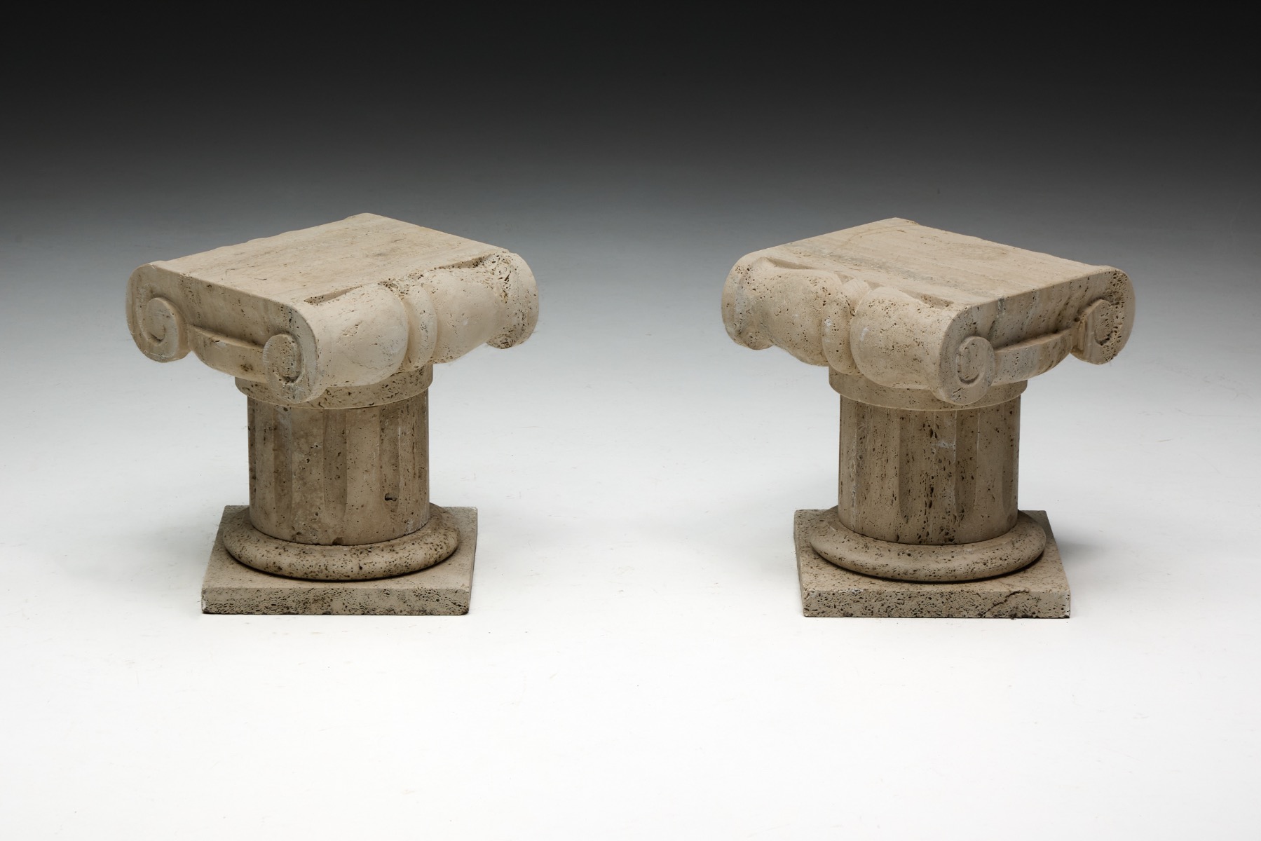 Italian travertine side table echoing classical Ionic proportions
