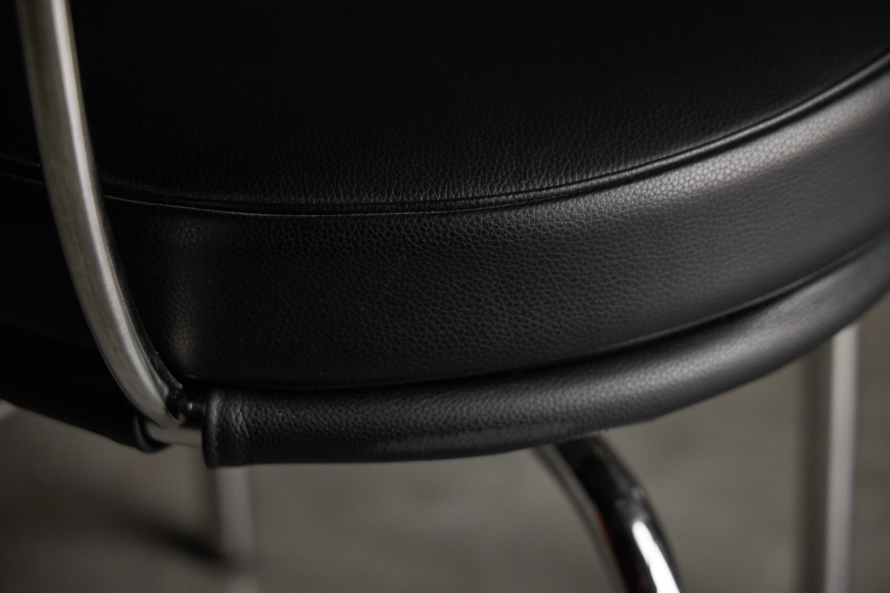 Modernist LC7 swivel chairs with architectural proportions