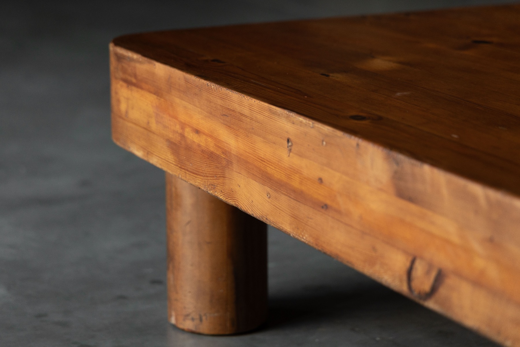 Architectural brutalist pine coffee table with monolithic presence