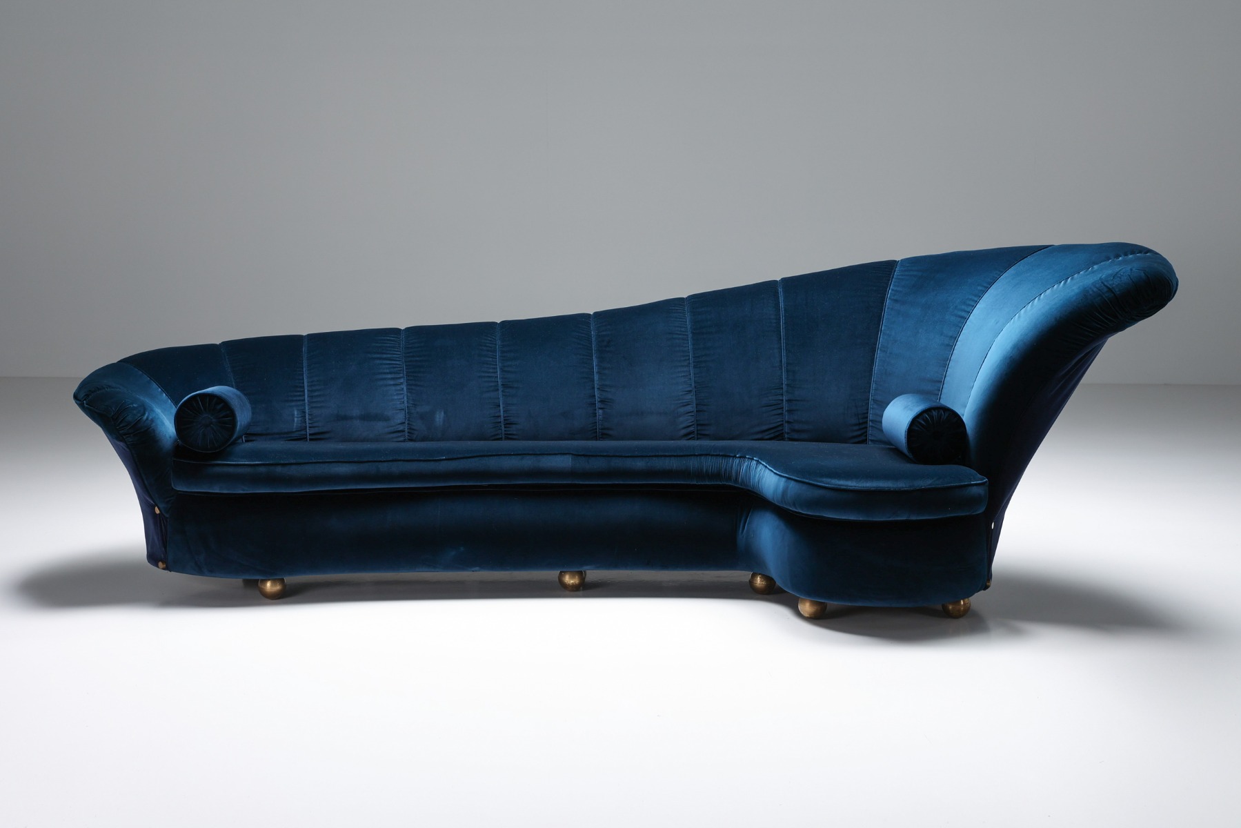 Plush curved velvet sofa dating to the 1970s