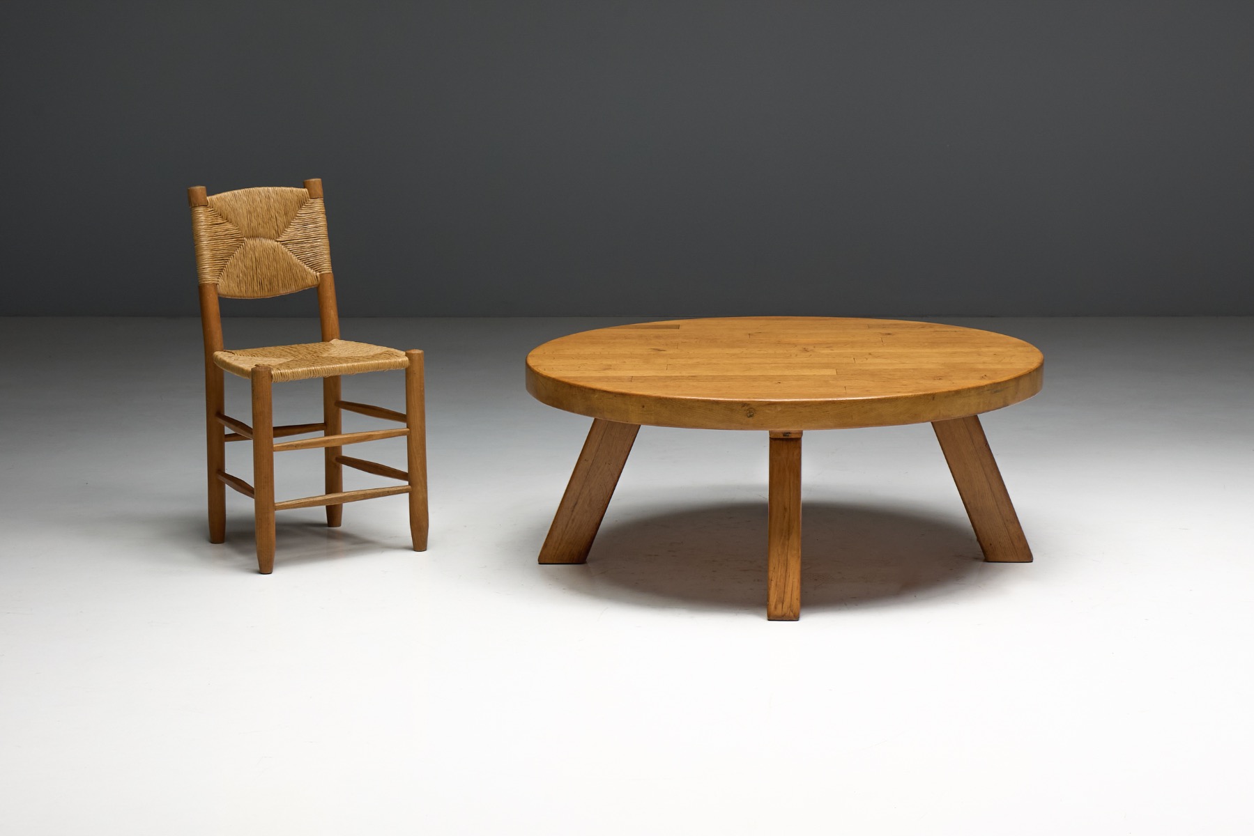 Primitive brutalist round coffee table with raw wooden character