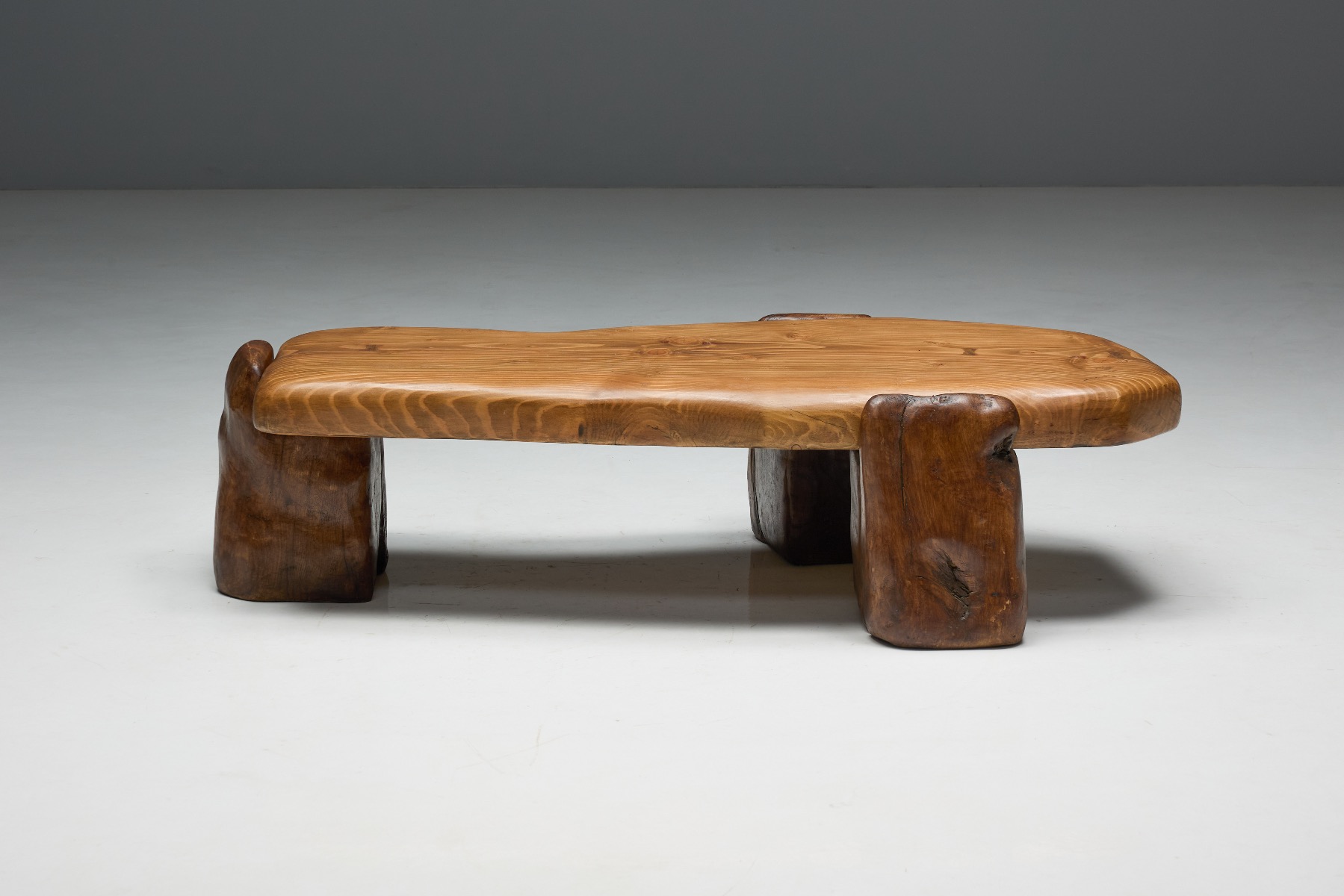 Raw textured brutalist coffee table with monolithic form