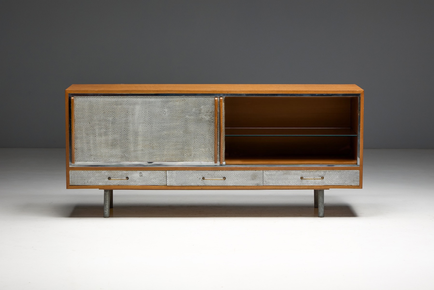 Refined modern sideboard combining wood and hammered metal