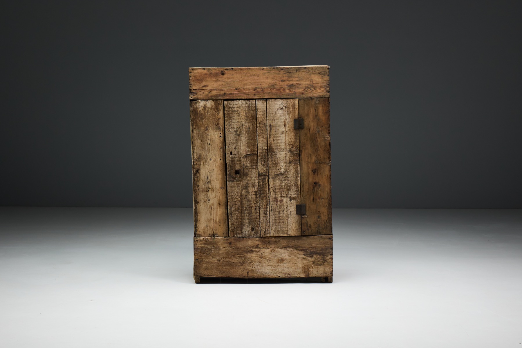 Rustic antique wood cabinet showing rich texture and age character