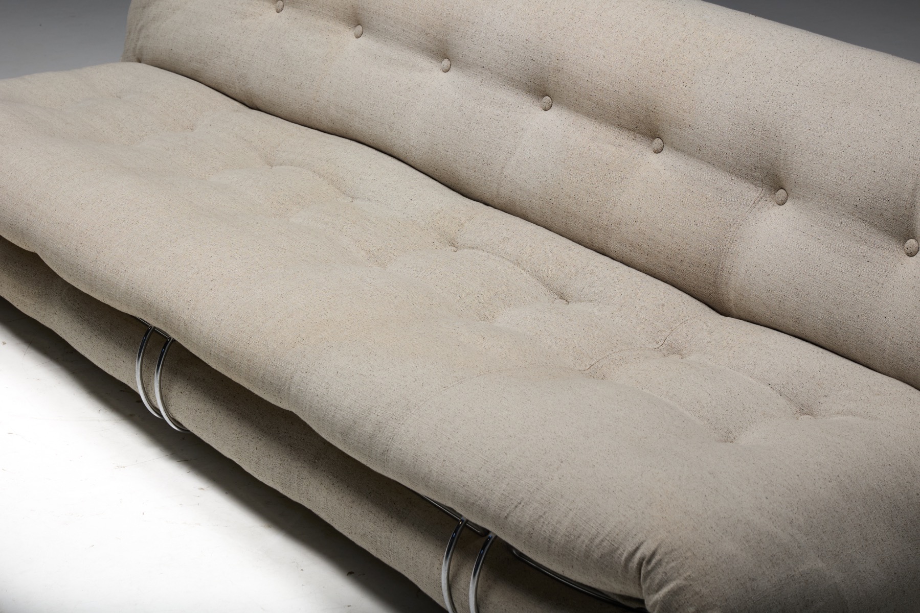 Soriana sofa with loose upholstery and metal clamp construction