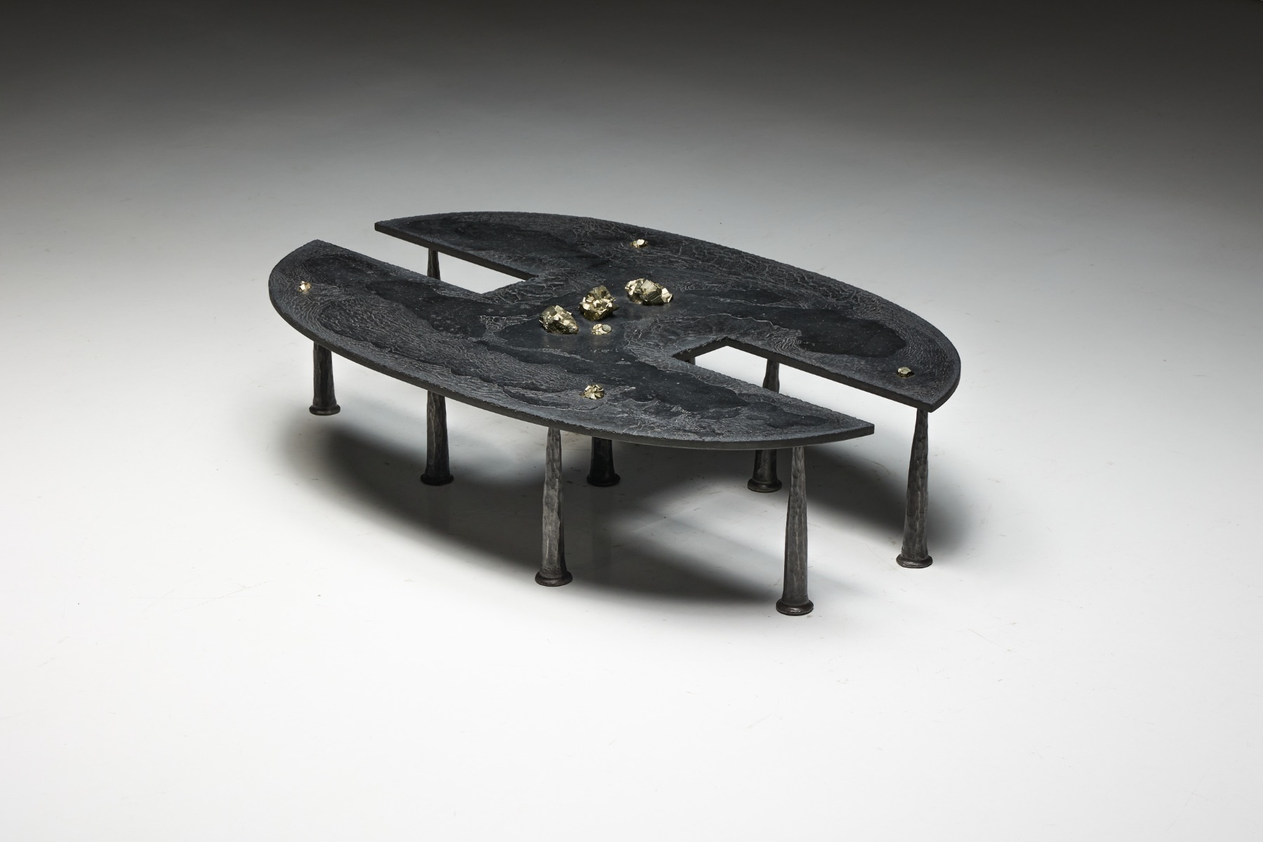 Iron brutalist coffee table with mineral embedded surface by Thomas Serruys