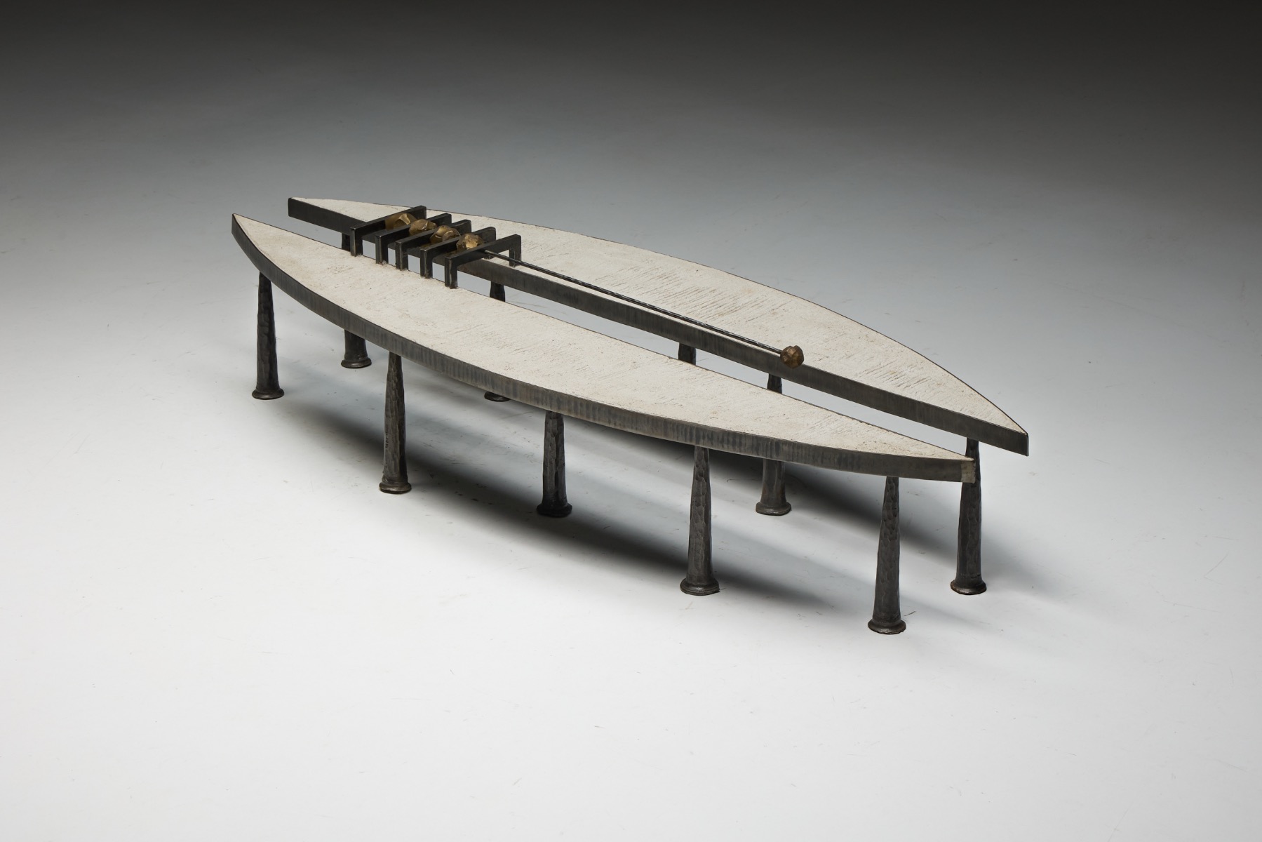 Steel framed coffee table with stone element designed by Thomas Serruys