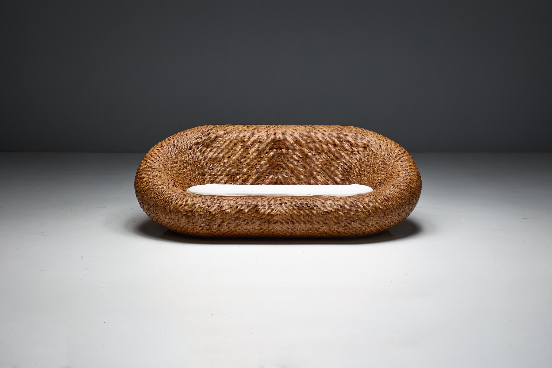 Collectible woven wicker sofa with vintage appeal
