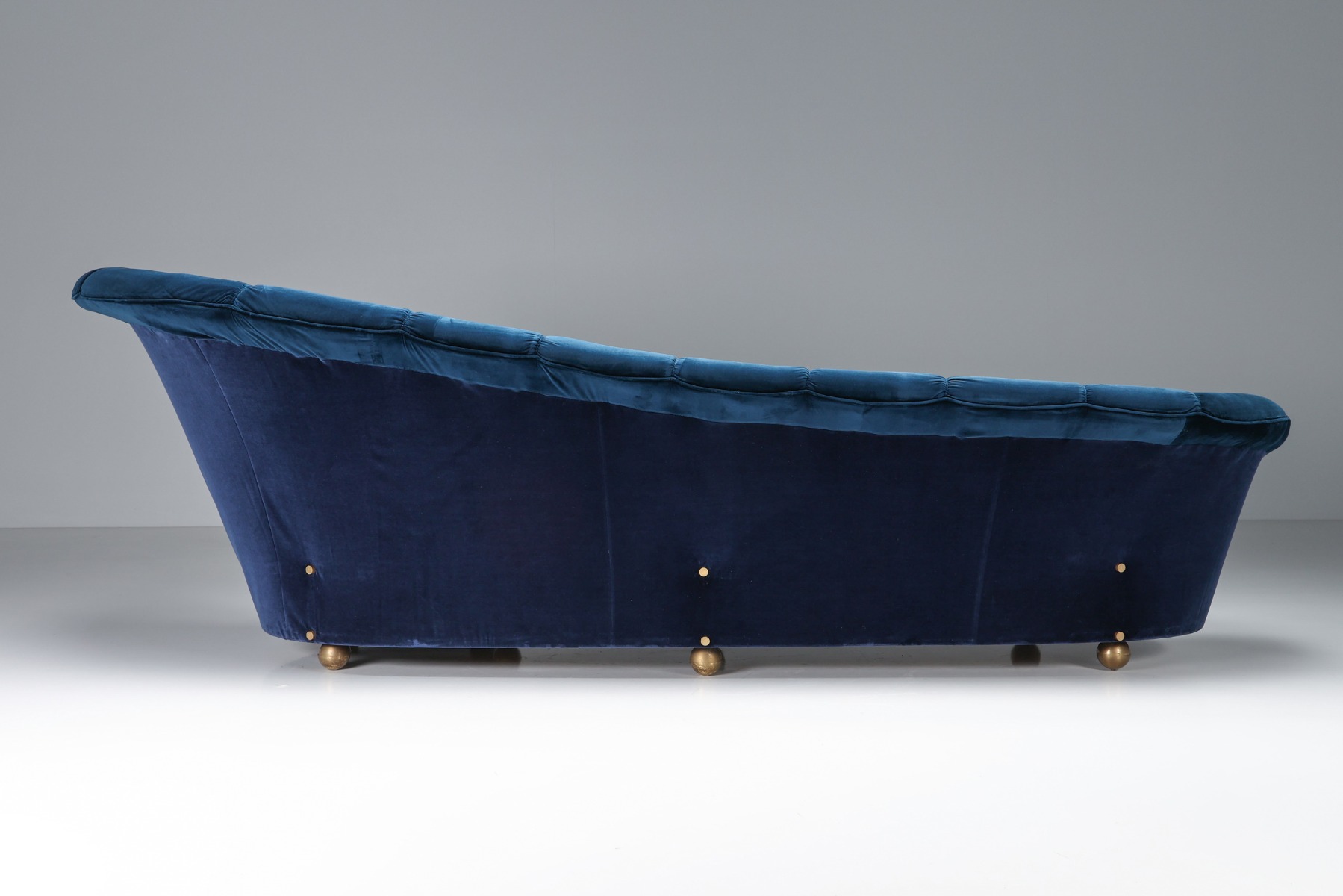 Dramatic Hollywood Regency velvet sofa with sculptural form