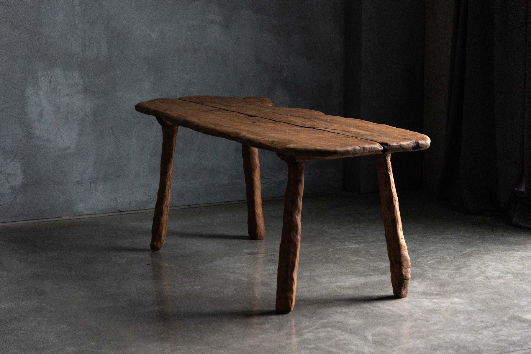 Expressive raw wood table in wabi sabi style