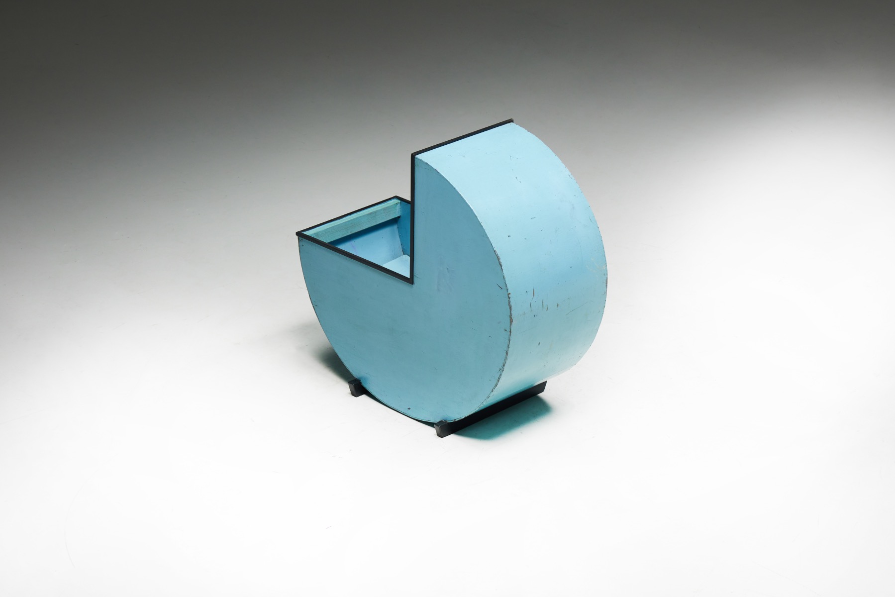 Hand painted blue wood cradle in circular form