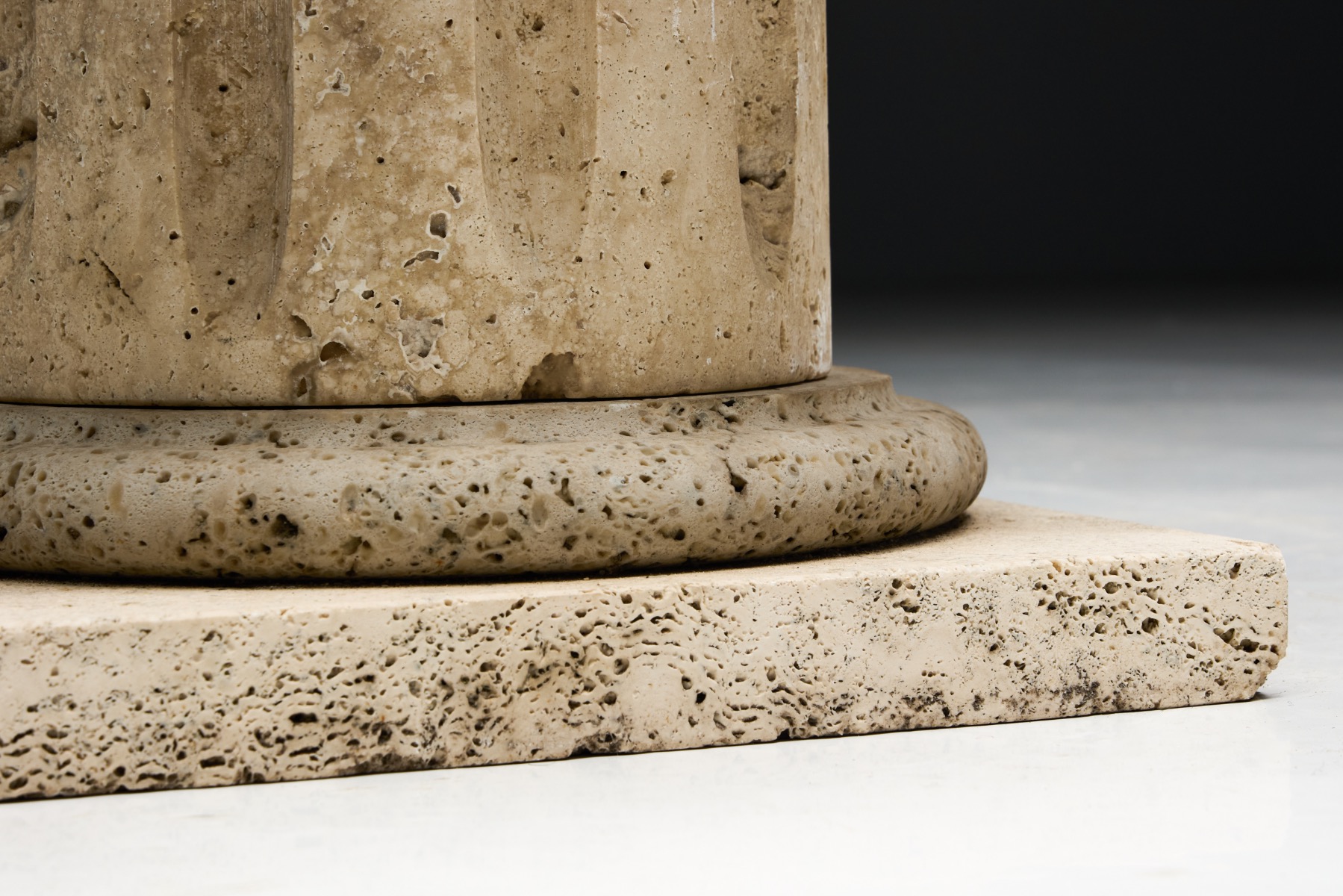Monumental travertine pedestal side table with softened edges
