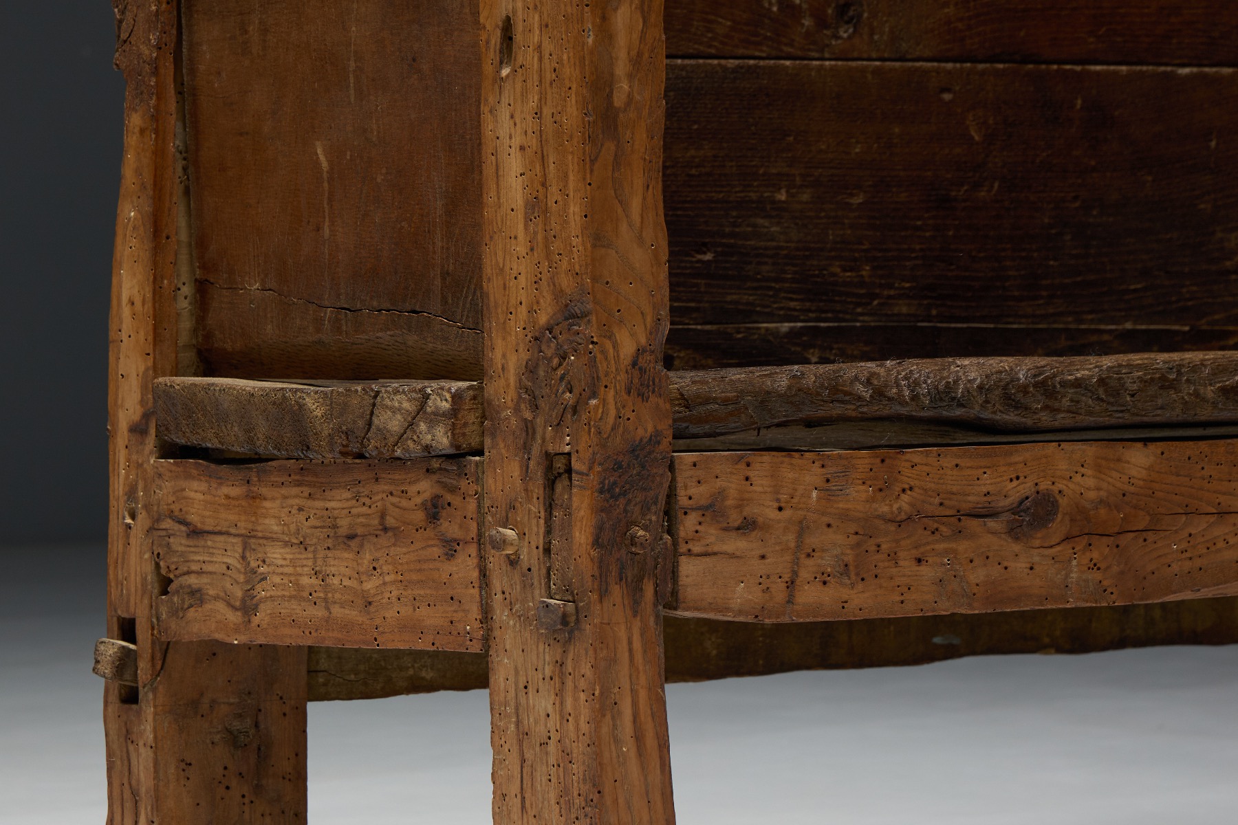 Museum level primitive wooden bench from the 19th century
