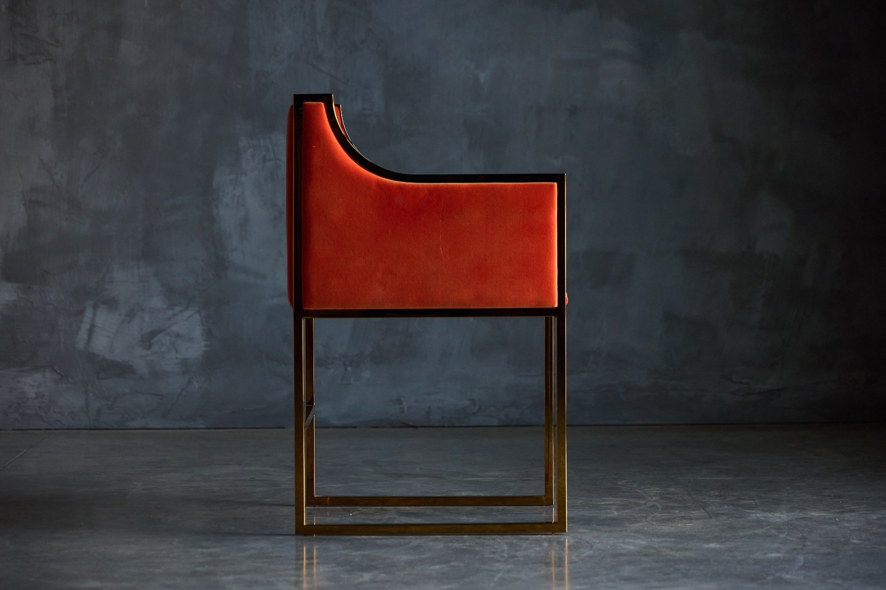 Chic brass and orange velvet dining chairs