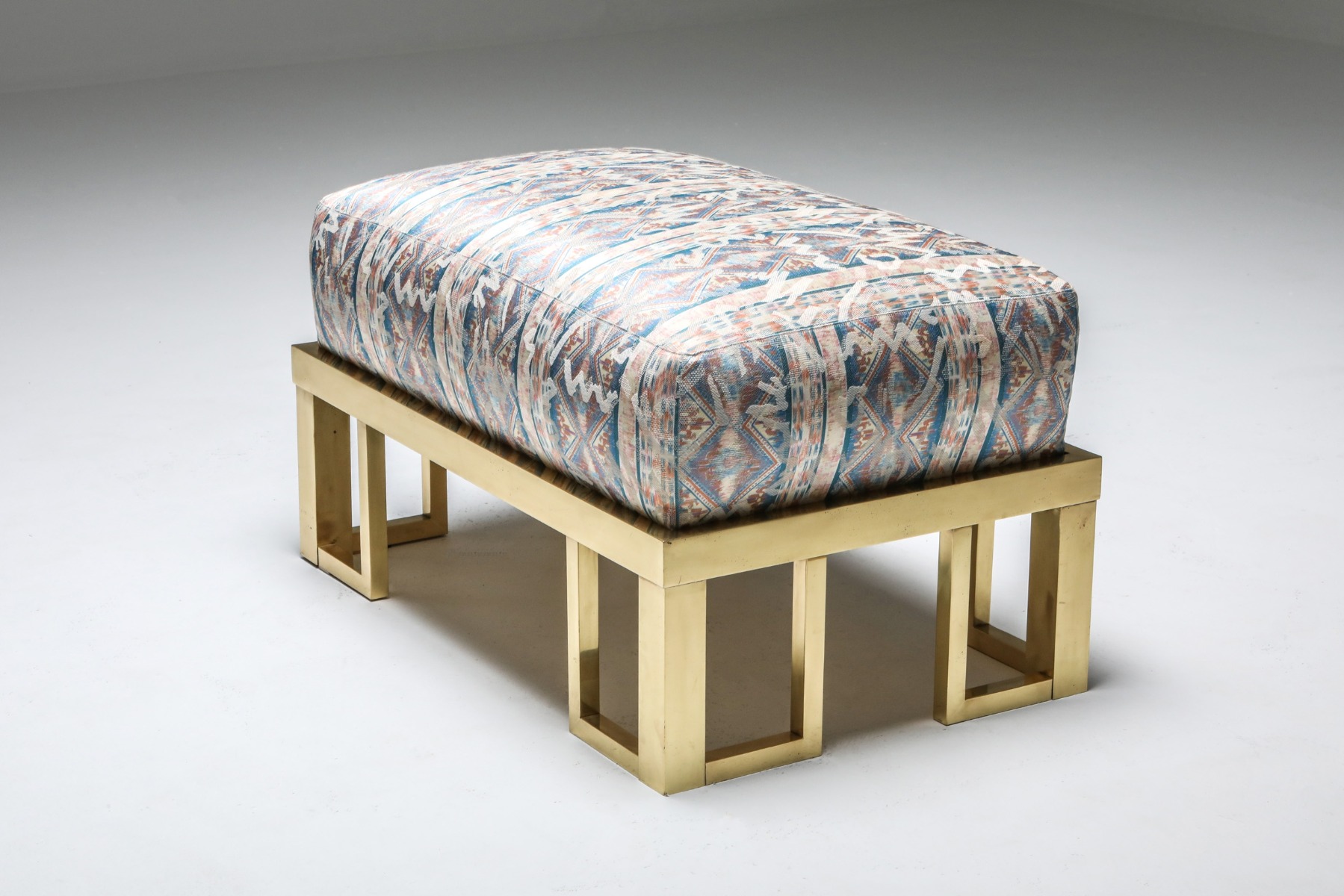 Timeless brass lounge chair and ottoman design