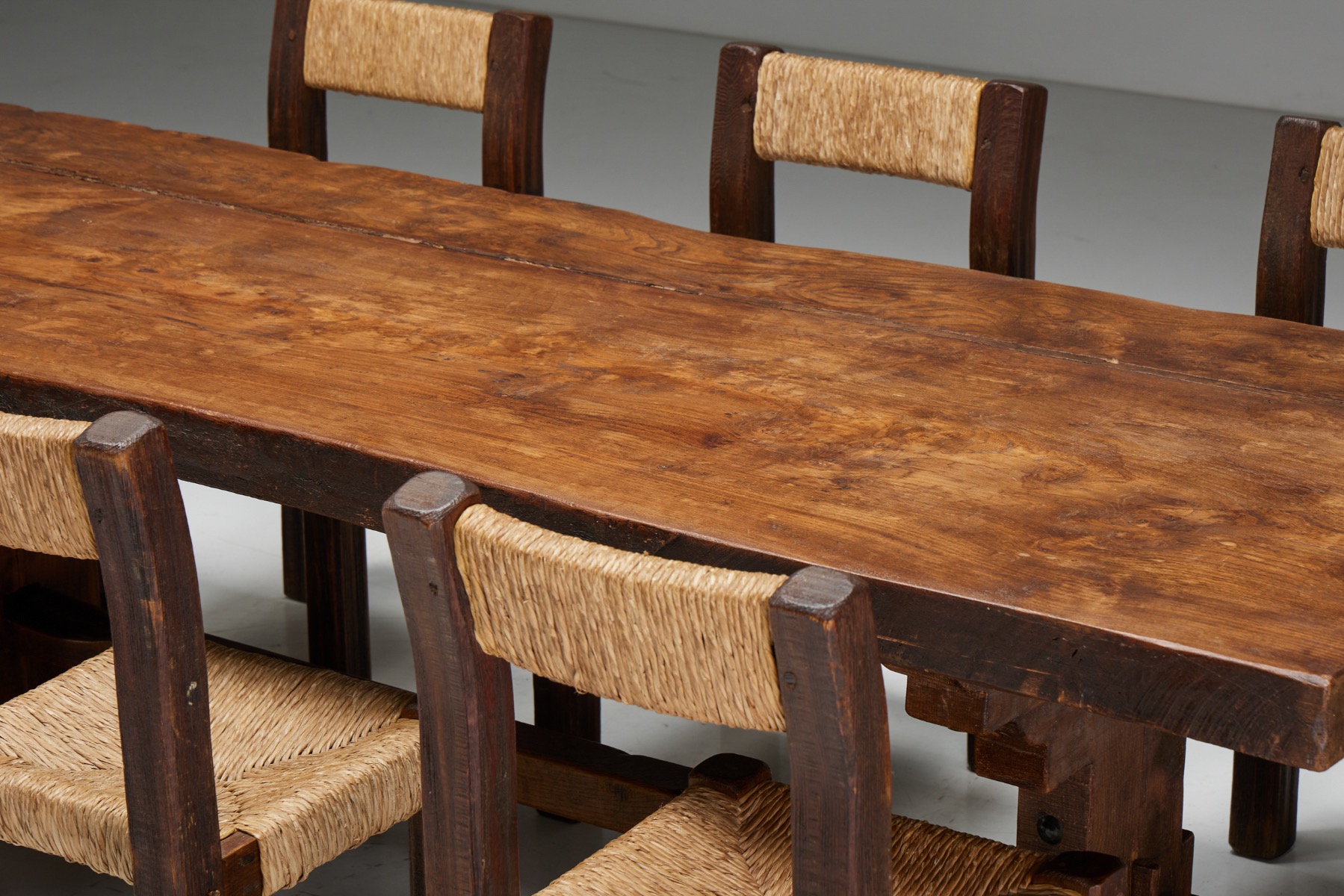 Aged wood brutalist dining table in primitive design