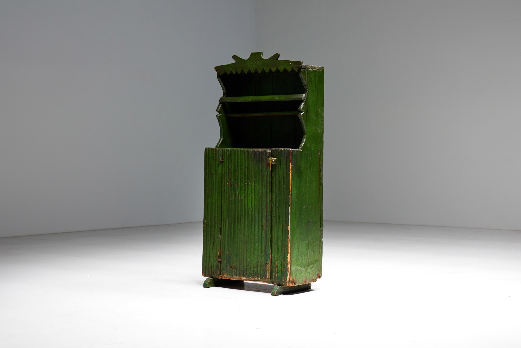 Aged wood folk art cabinet in primitive design
