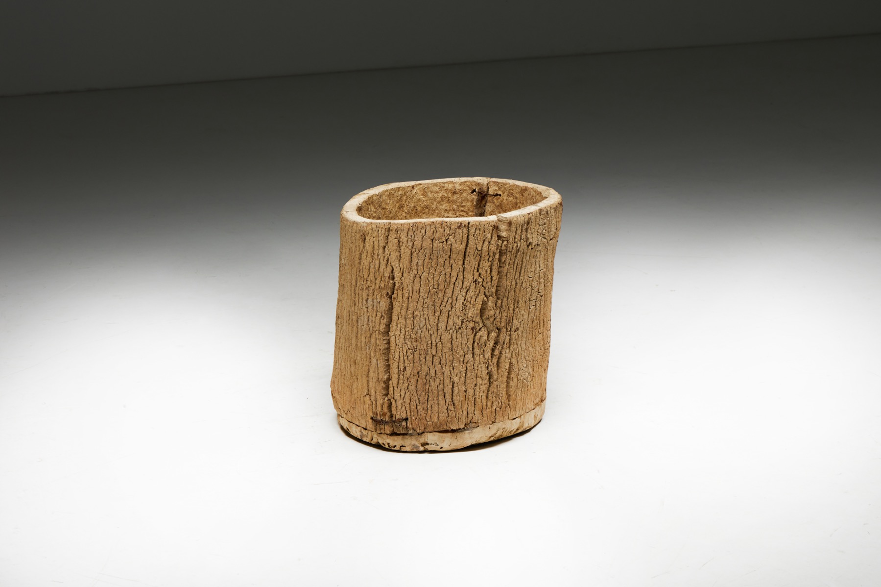 Aged wood tree trunk basket in primitive design