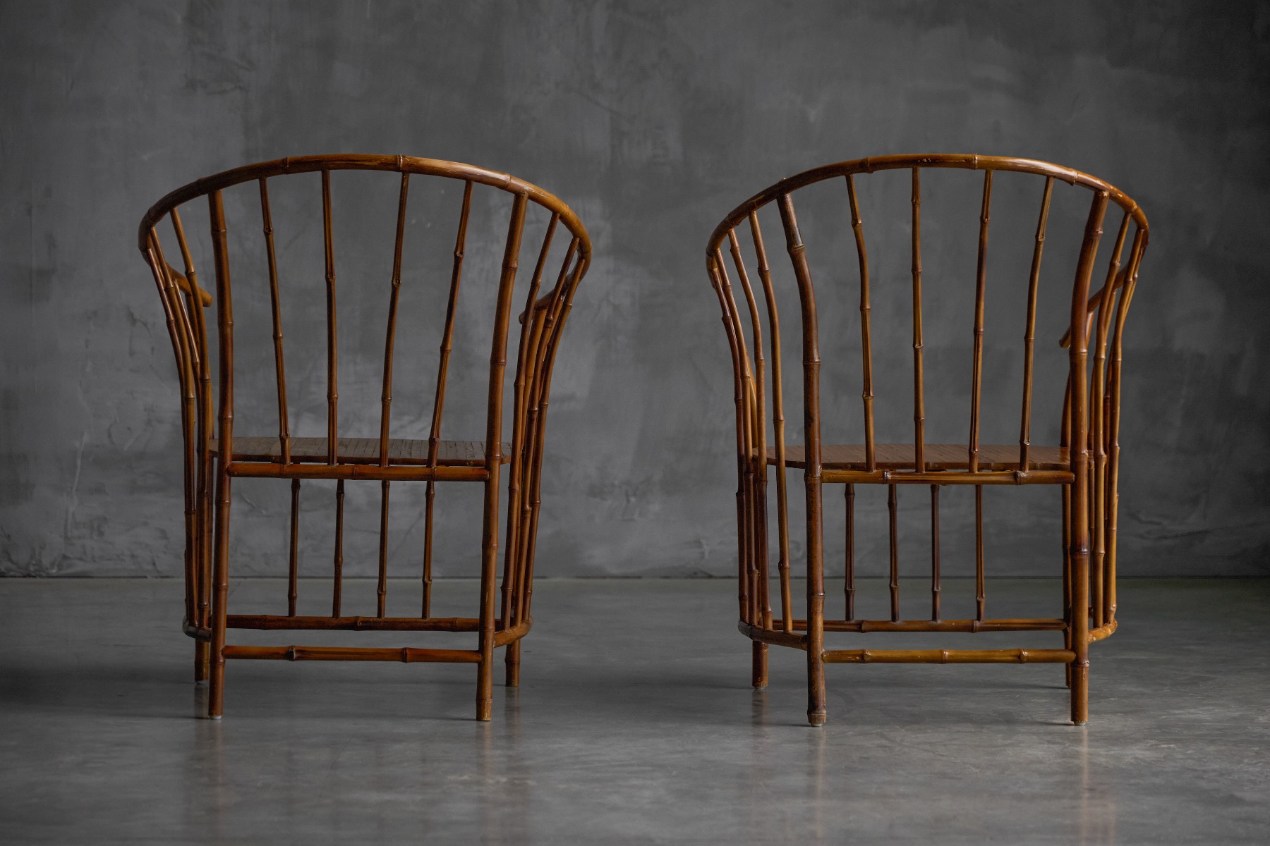 Earthy vintage bamboo armchairs with natural finish