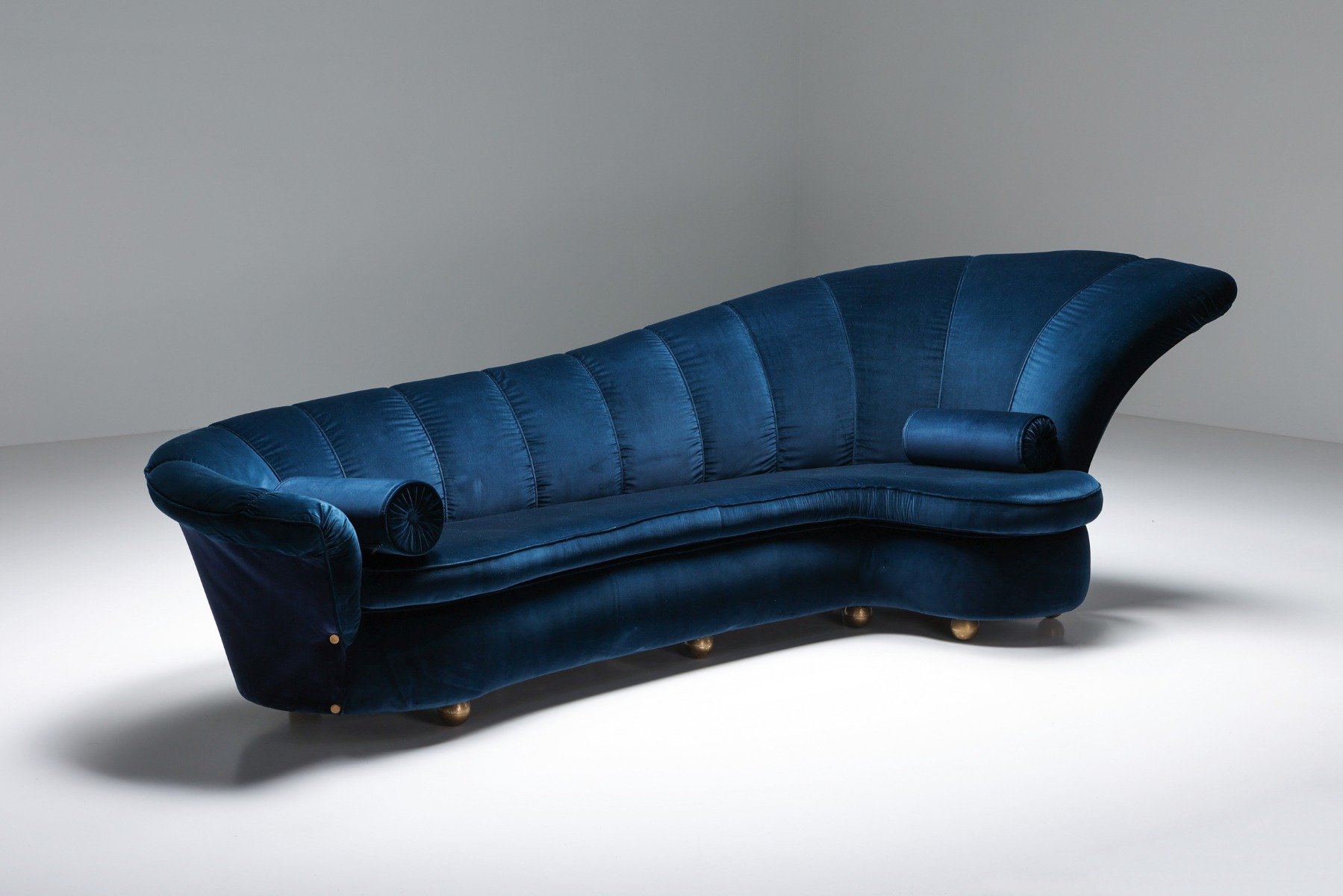 European curved velvet sofa in Hollywood Regency style