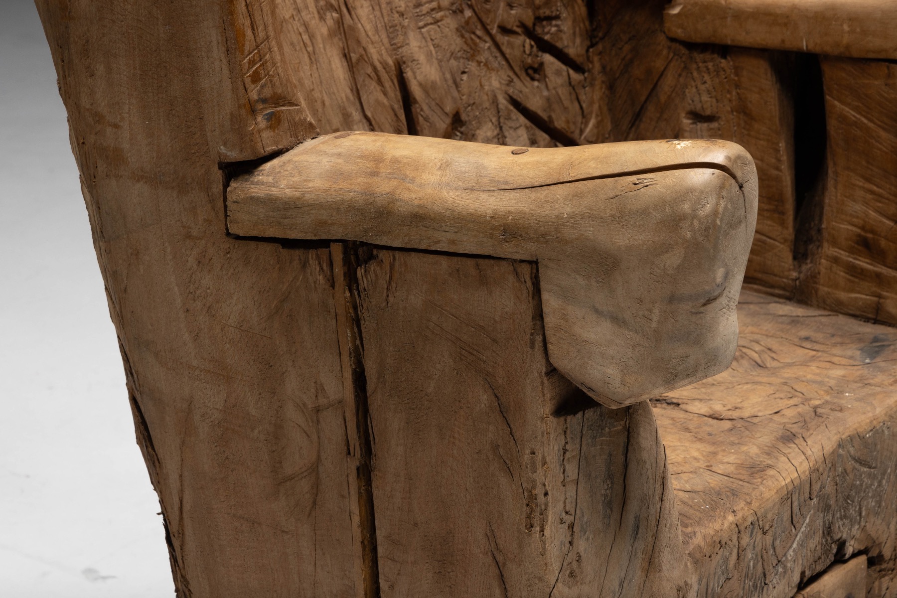 Expressive brutalist throne chair carved in solid wood