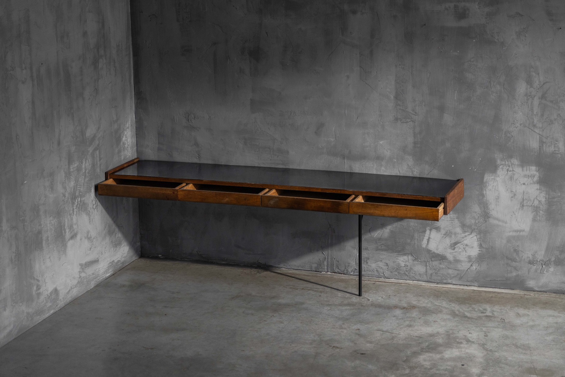 Floating wall mounted console table emphasizing slender modern lines