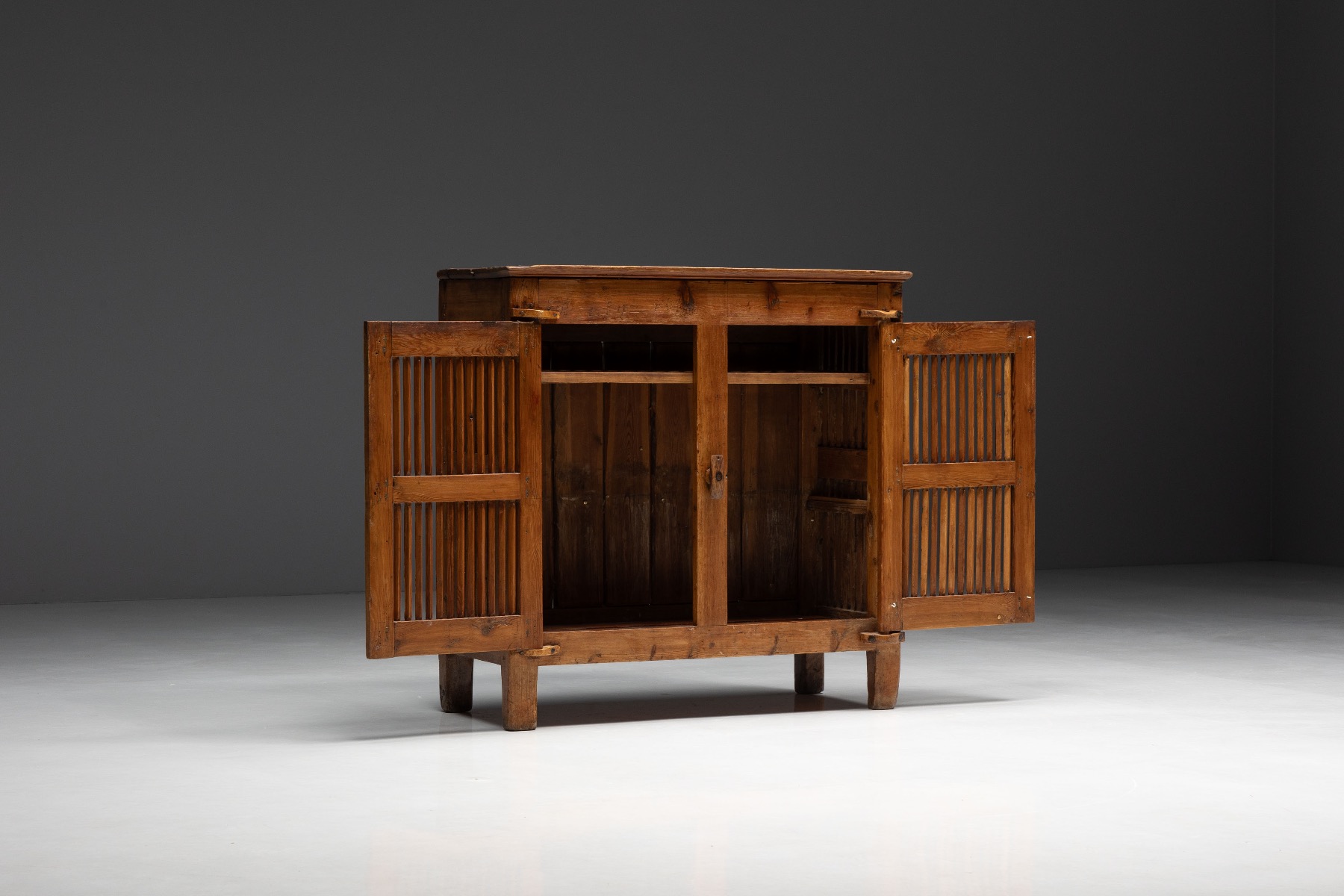 Handcrafted alpine tommière cabinet with regional character