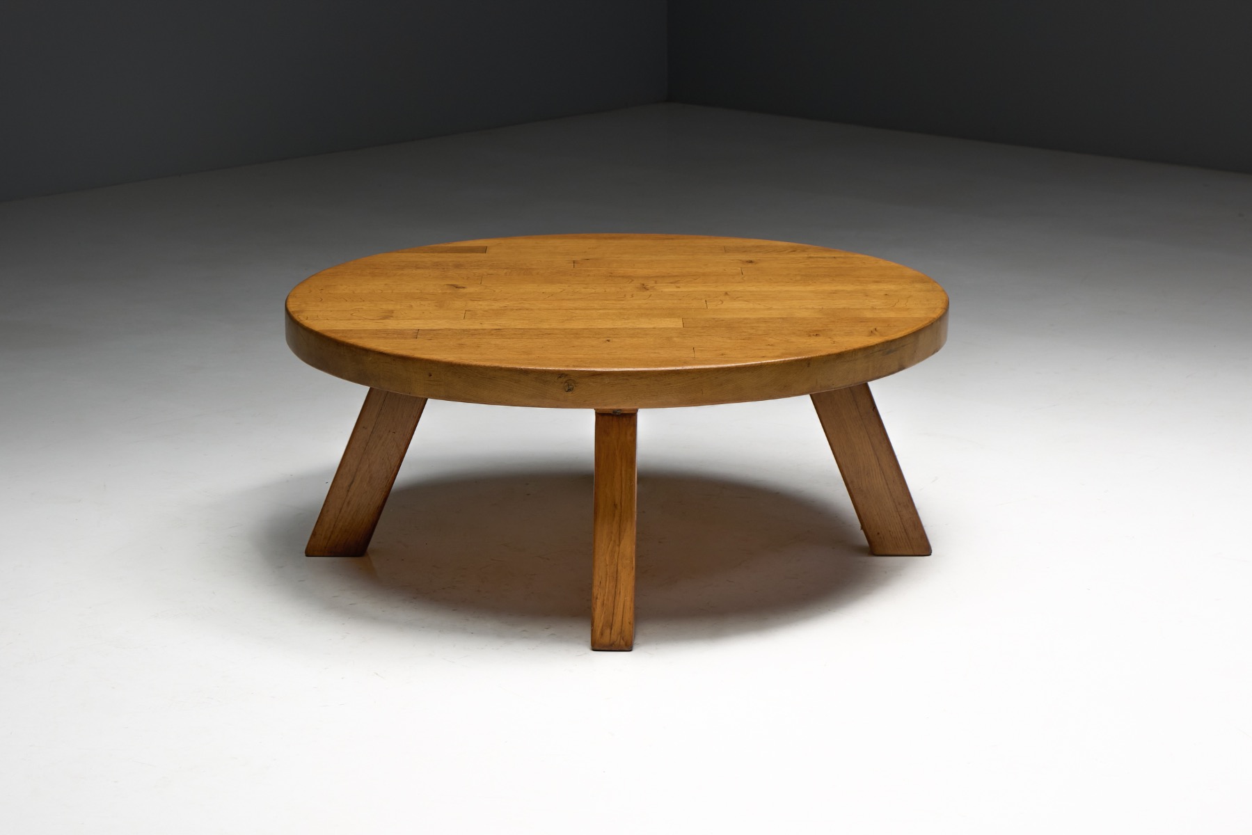 Heavy solid wood brutalist coffee table with circular form