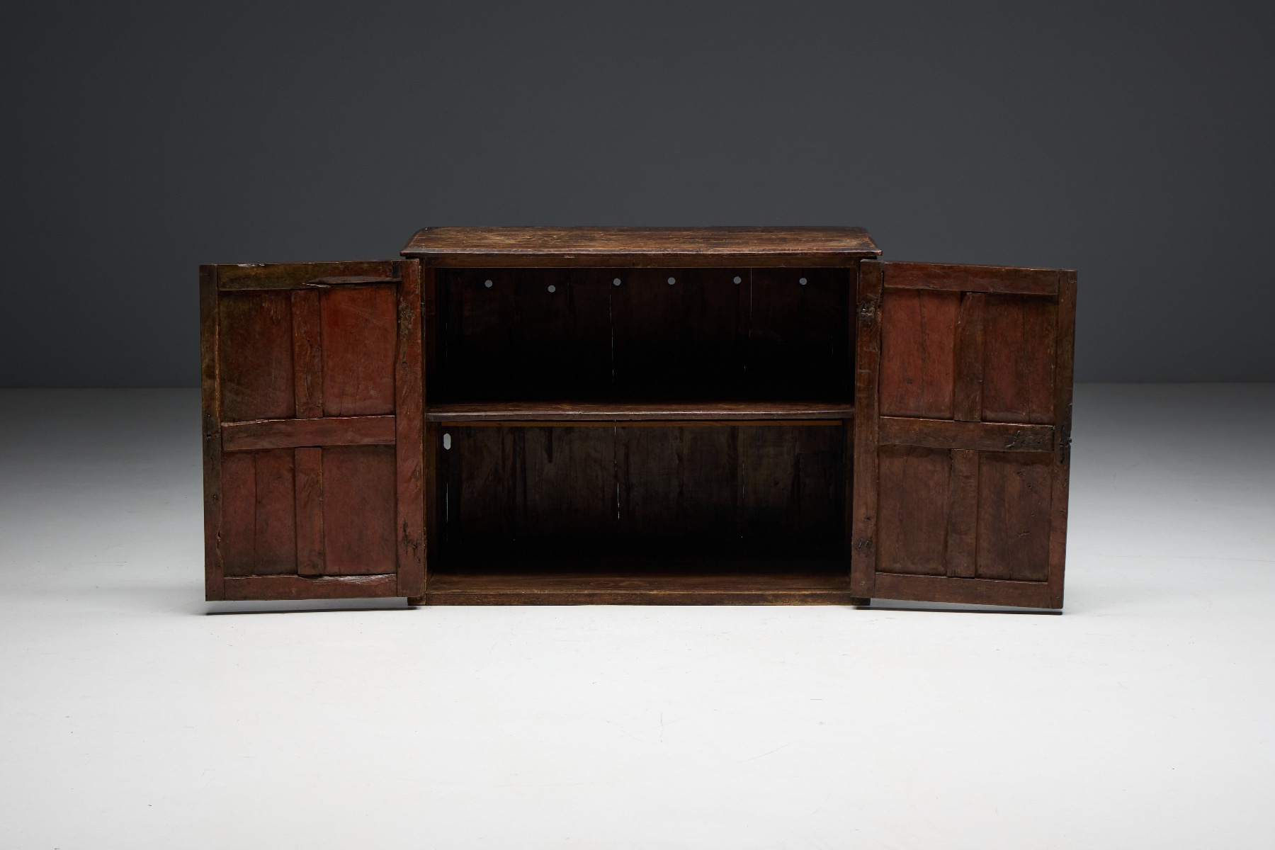 Historic rural carved cupboard with timeworn surface
