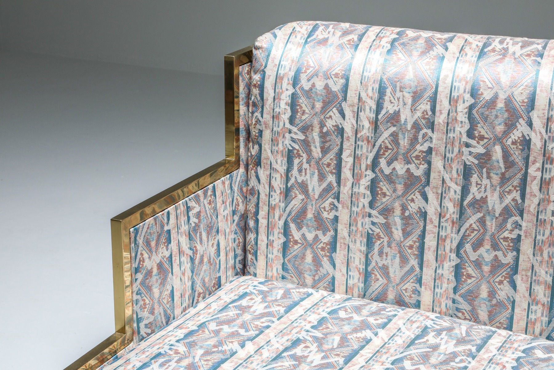 Luxury brass lounge chair and ottoman from the 1970s style