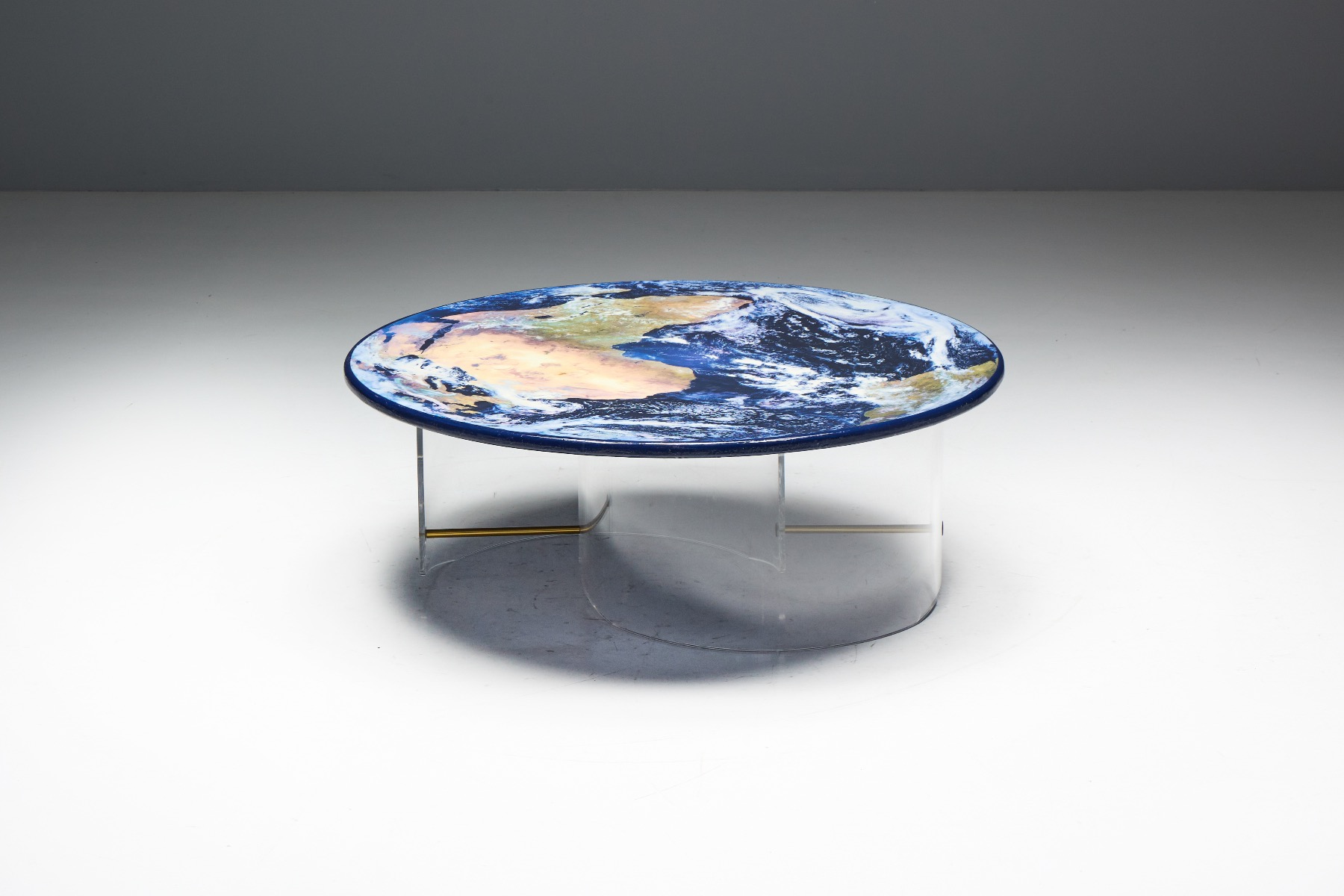Minimalist globe coffee table with transparent base