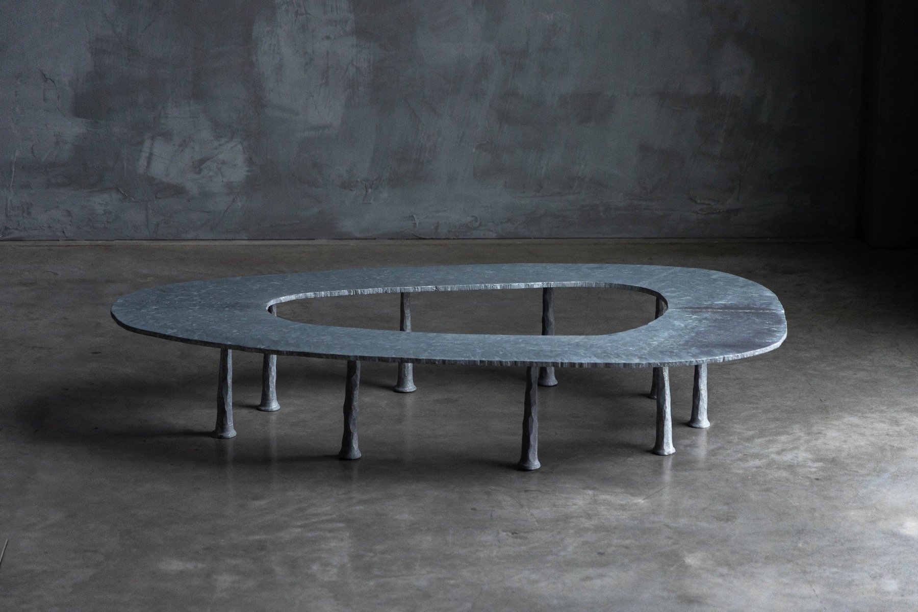 Artisan crafted elliptical table by Serruys