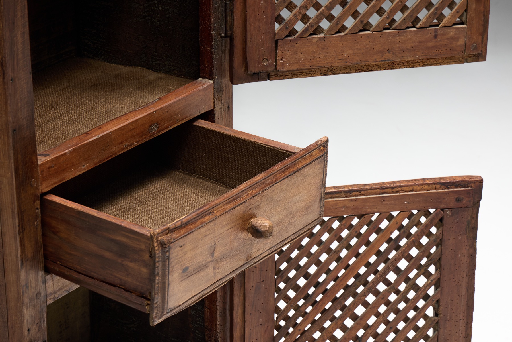 Primitive rustic cabinet reflecting 19th century folk art