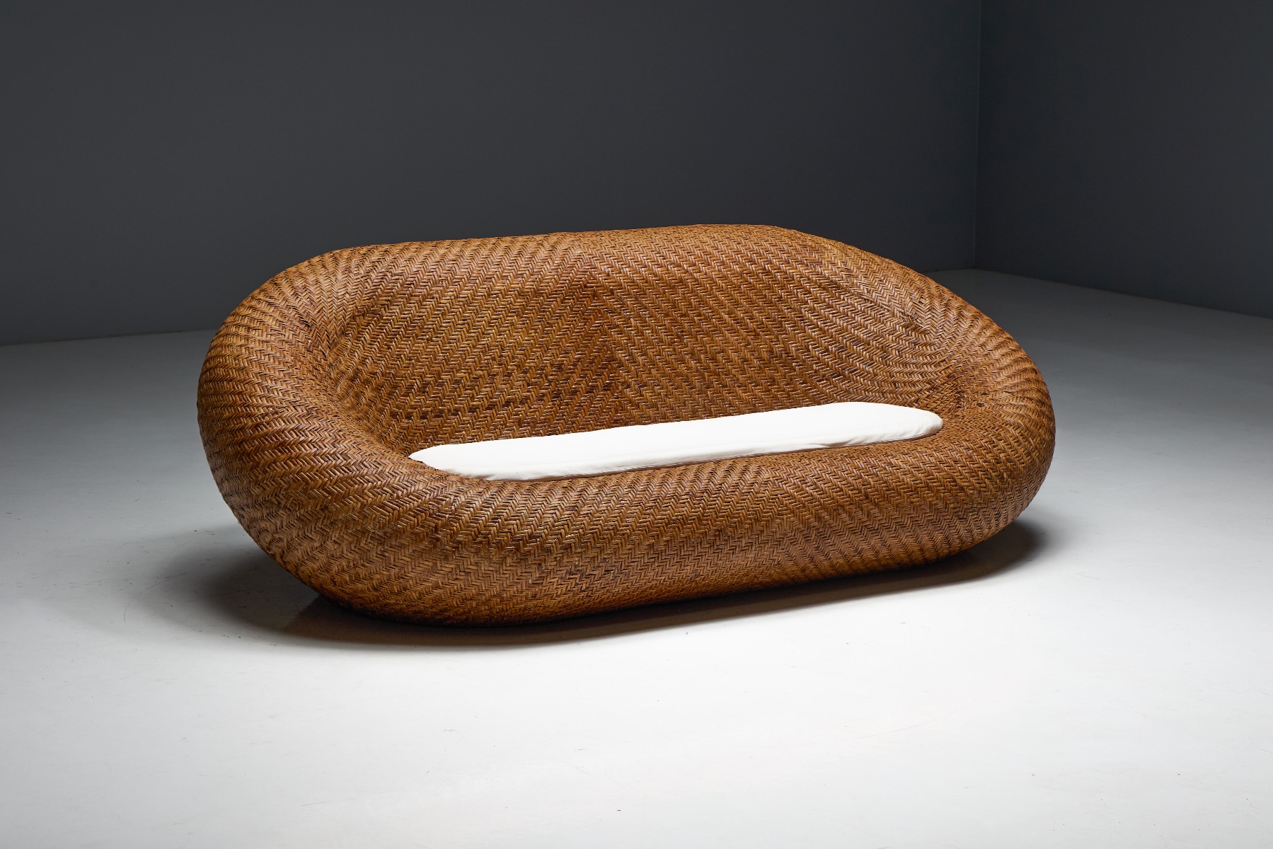 Relaxed modern wicker sofa from the mid century period