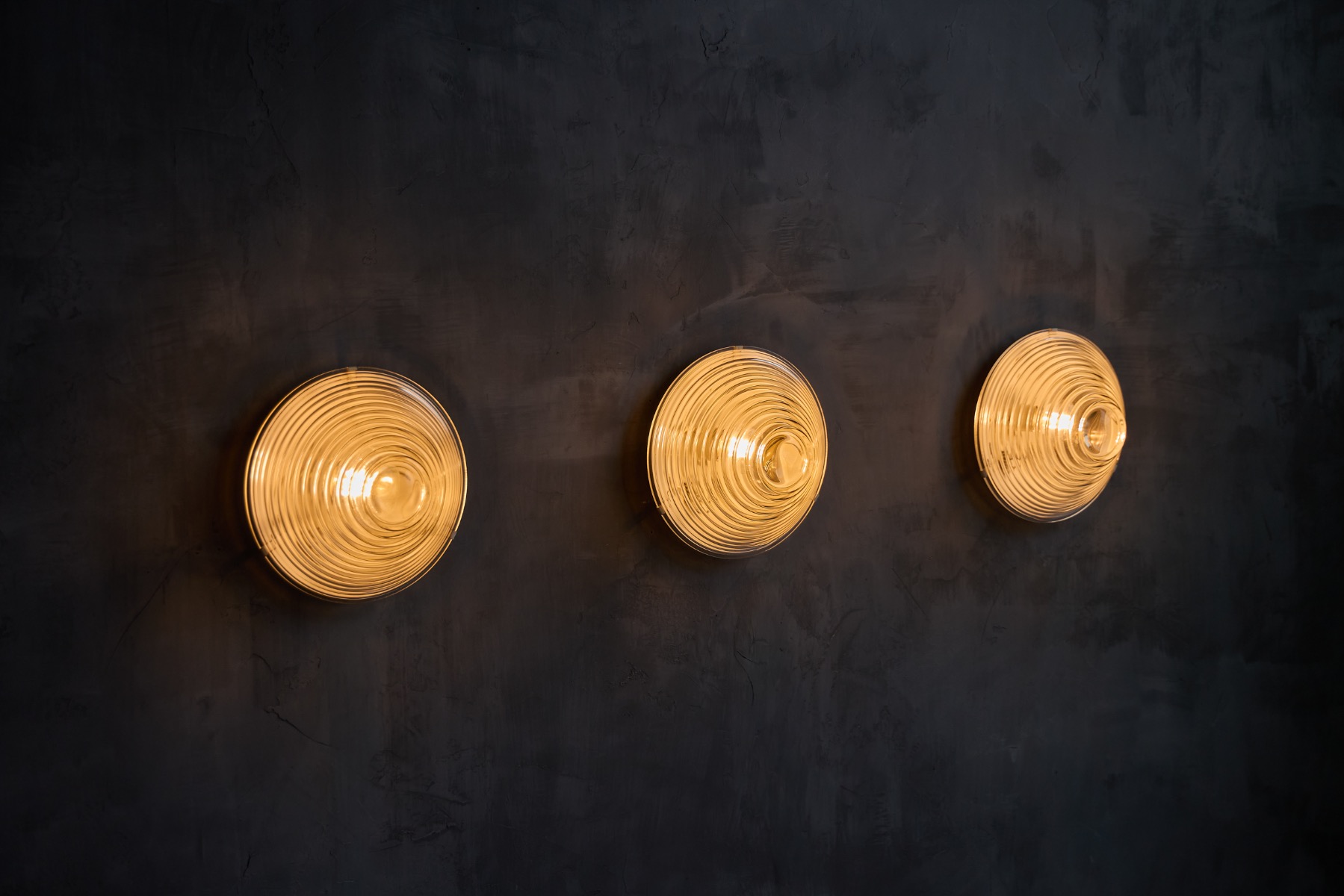 Ribbed glass wall lights influenced by the work of Mario Bellini