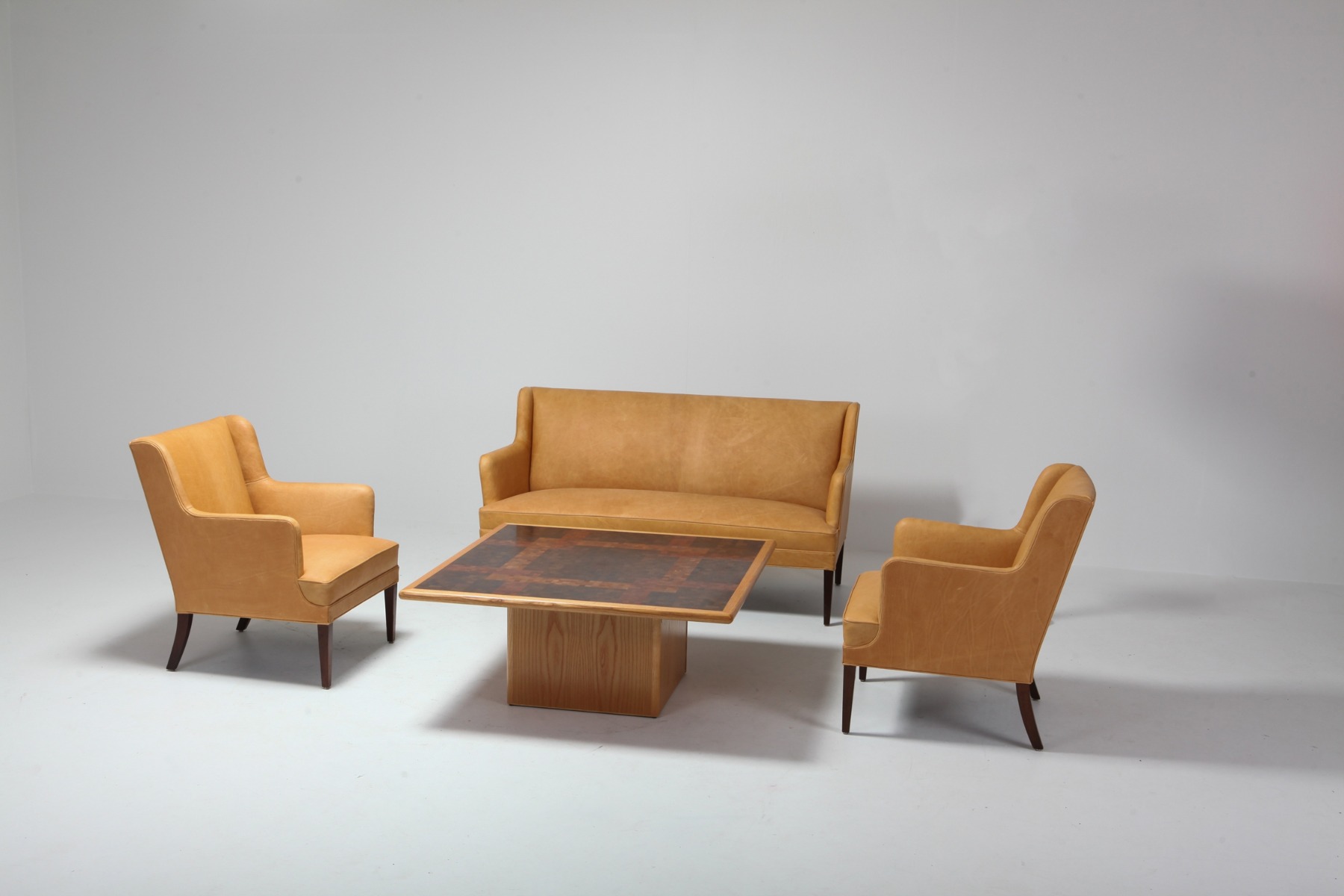 Statement bergere chairs in camel leather from the 1960s