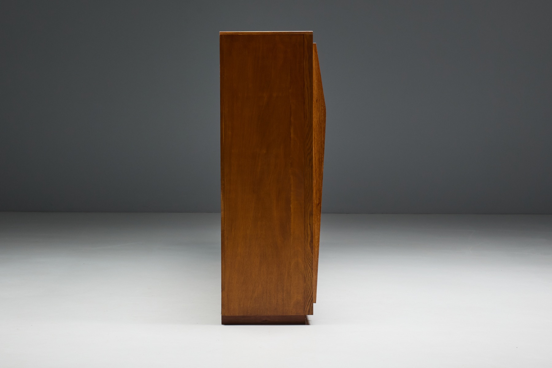 Mid 20th century storage cabinet with sliding wood doors and internal shelving  