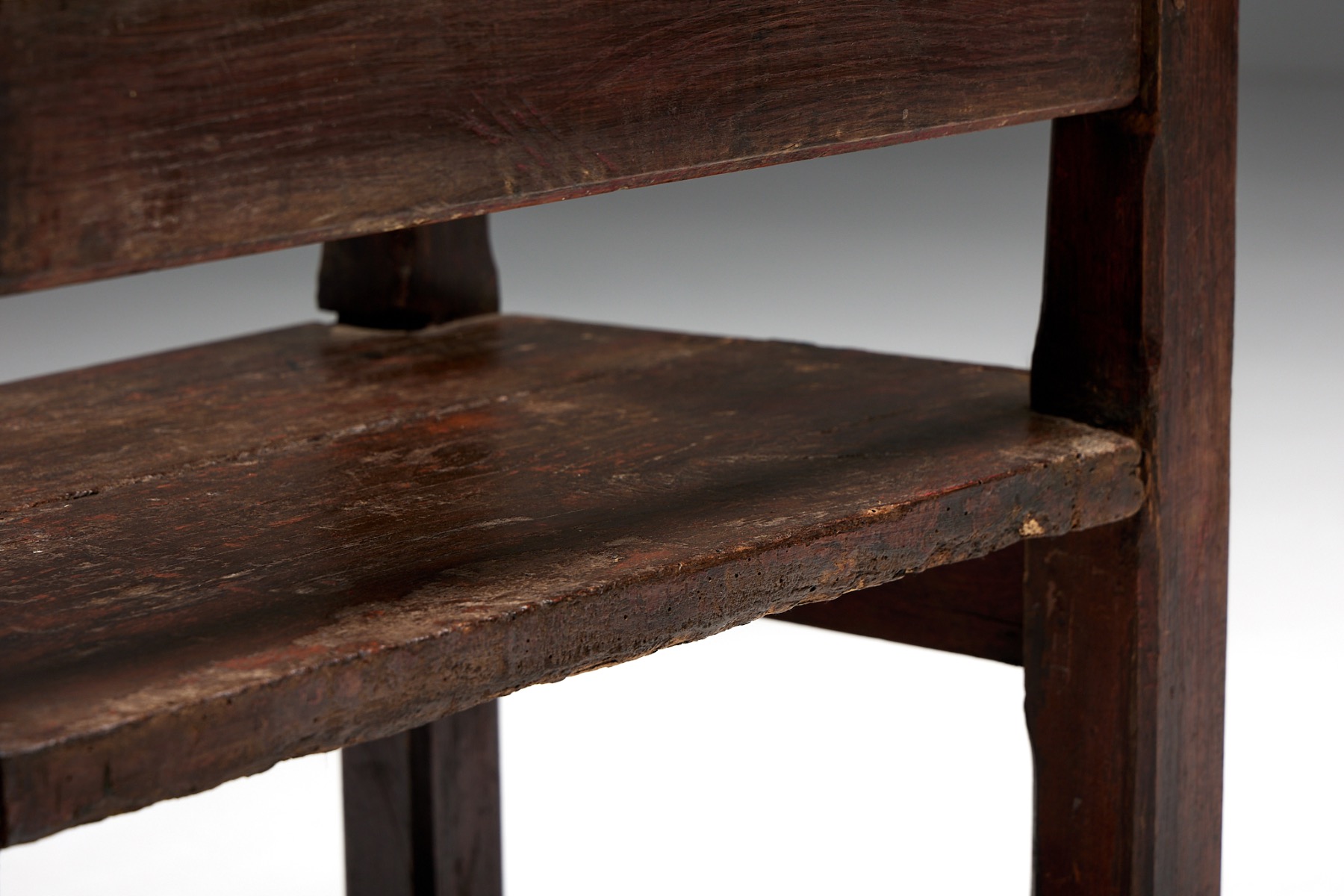 Aged wood naive folk bench in primitive design