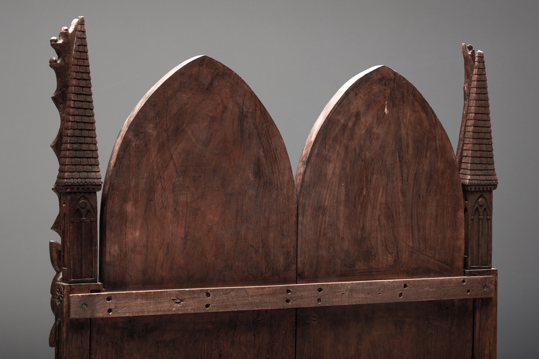 Aged wood throne chair with ornamental relief